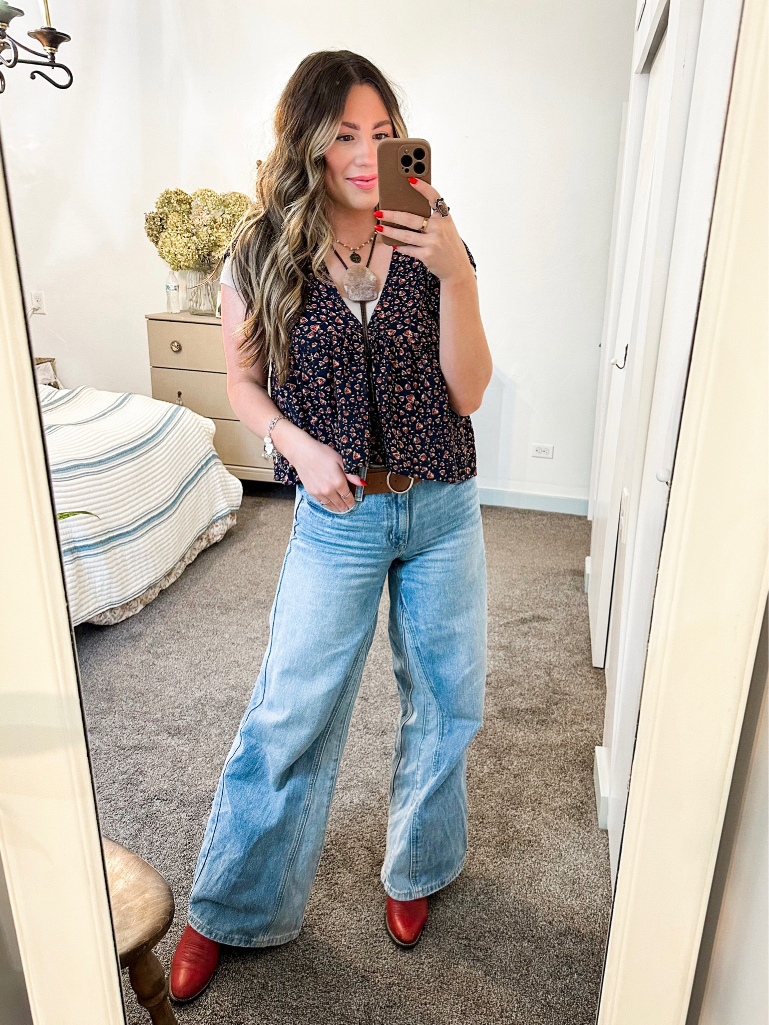 Valentine’s Day outfit idea! A subtle pop of red with the cowgirl boots and the rose pattern on the shirt. Paired with some wide leg jeans and a bolo tie for the chunky jewelry look 

#LTKshoecrush #LTKMostLoved #LTKstyletip