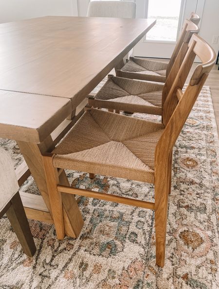 Dining table, farmhouse style kitchen, transitional home decor, boho rattan chairs, dining chairs, dining room rug, neutral pink rug, boho rug 

#LTKhome #LTKstyletip #LTKsalealert