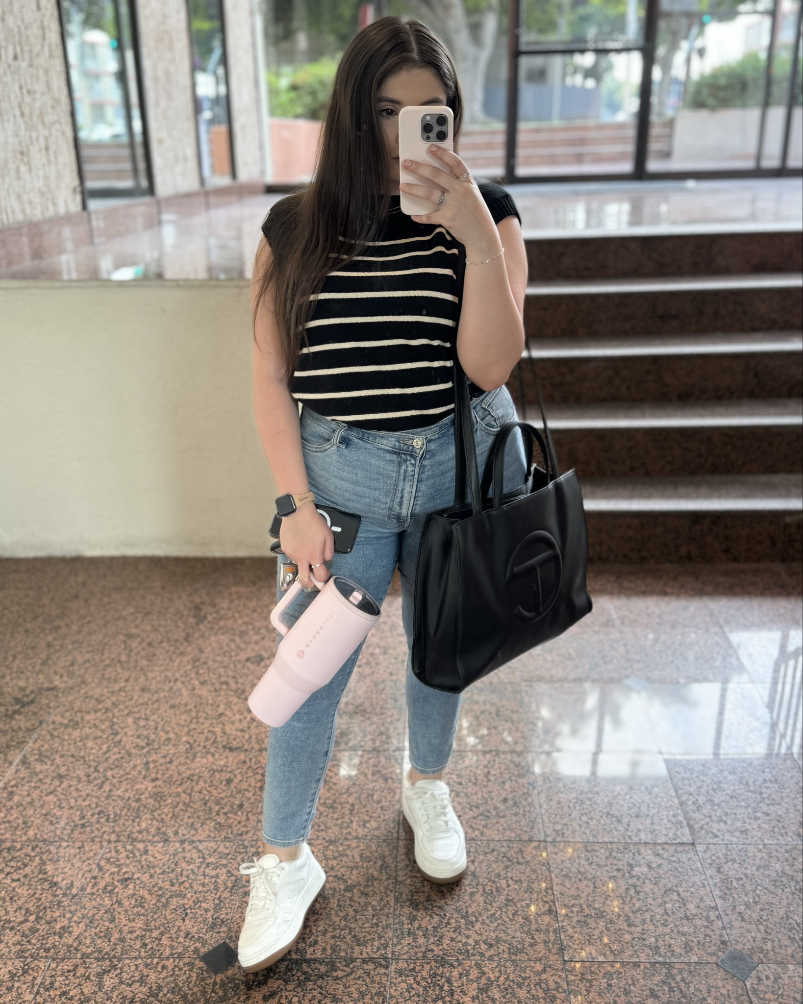 Smart Casual 👩🏻‍💻- my favorite way to dress to the office as a t-shirt and leggings girl in my off time. I need comfort during my work day. 😤 

(Peep the Stanley leakproof dupe. 👀)

👚 Amazon
👖 Good American
👜 Telfar
👟 Alo Yoga
🥤 Hydrojug
⌚️ Apple



#LTKStyleTip #LTKWorkwear #LTKMidsize