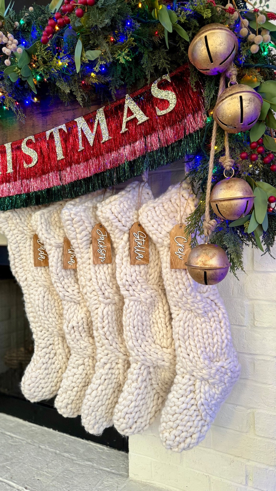 My Christmas mantle is almost finished and I am so excited about it! I’m trying to But also keep it aesthetic and classy so this is totally out of my element and I was nervous about it, but I am in love with the direction it’s headed. I can’t wait to show you the whole thing! I’m obsessed with our stockings and stocking tags and these bells are one of my favorite Christmas decor items. The merry Christmas tinsel garland fits perfectly with my colorful nostalgic decor.

#LTKStyleTip #LTKHome #LTKHoliday