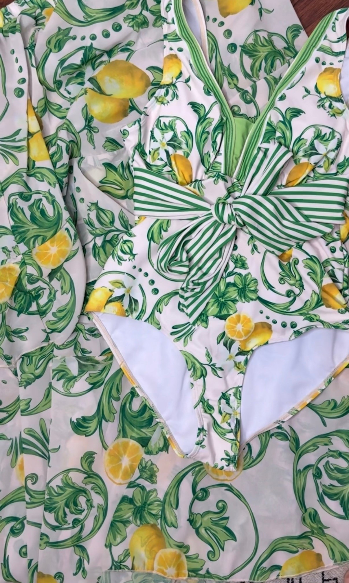 Lemon print and  green stripes one piece swimsuit set. Mom approve swimsuit . Runs slightly small but has stretch. Wear my TTS. 

#LTKmomlife #LTKSwim #LTKSeasonal