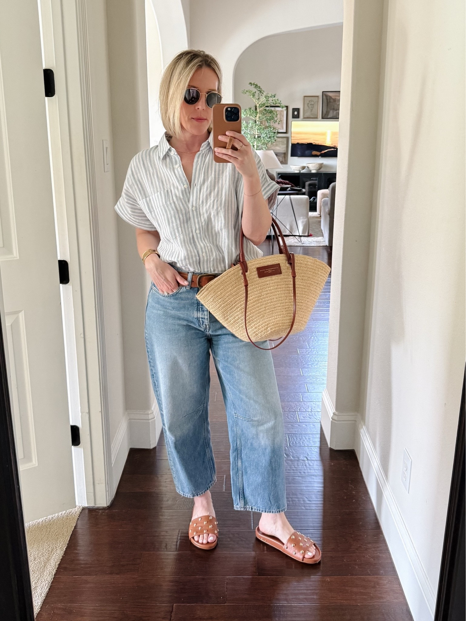 Blue stripe linen button up shirt, barrel leg jeans, brown Beek studded slides, woven basket bag



Casual summer outfit

#LTKOver40 #LTKMidsize #LTKxMadewell
