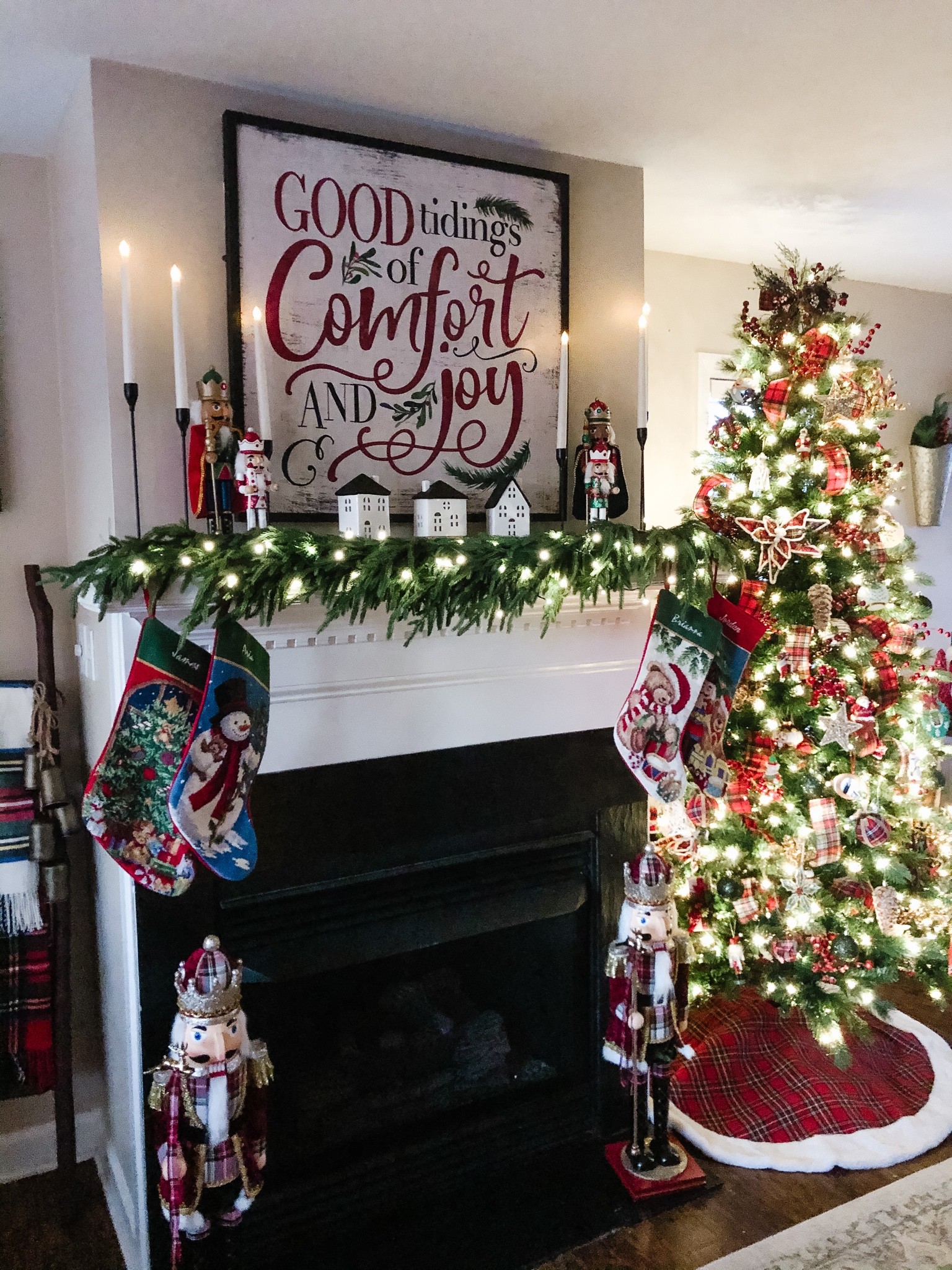 I look at my Christmas tree, all lit up at night with a beautiful lit garland and faux candle sticks to create the feeling of a wonderful cozy Christmas! #christmastree #garland #christmassign #treeskirt #christmasvillage #christmashouse

#LTKHoliday #LTKSeasonal #LTKhome