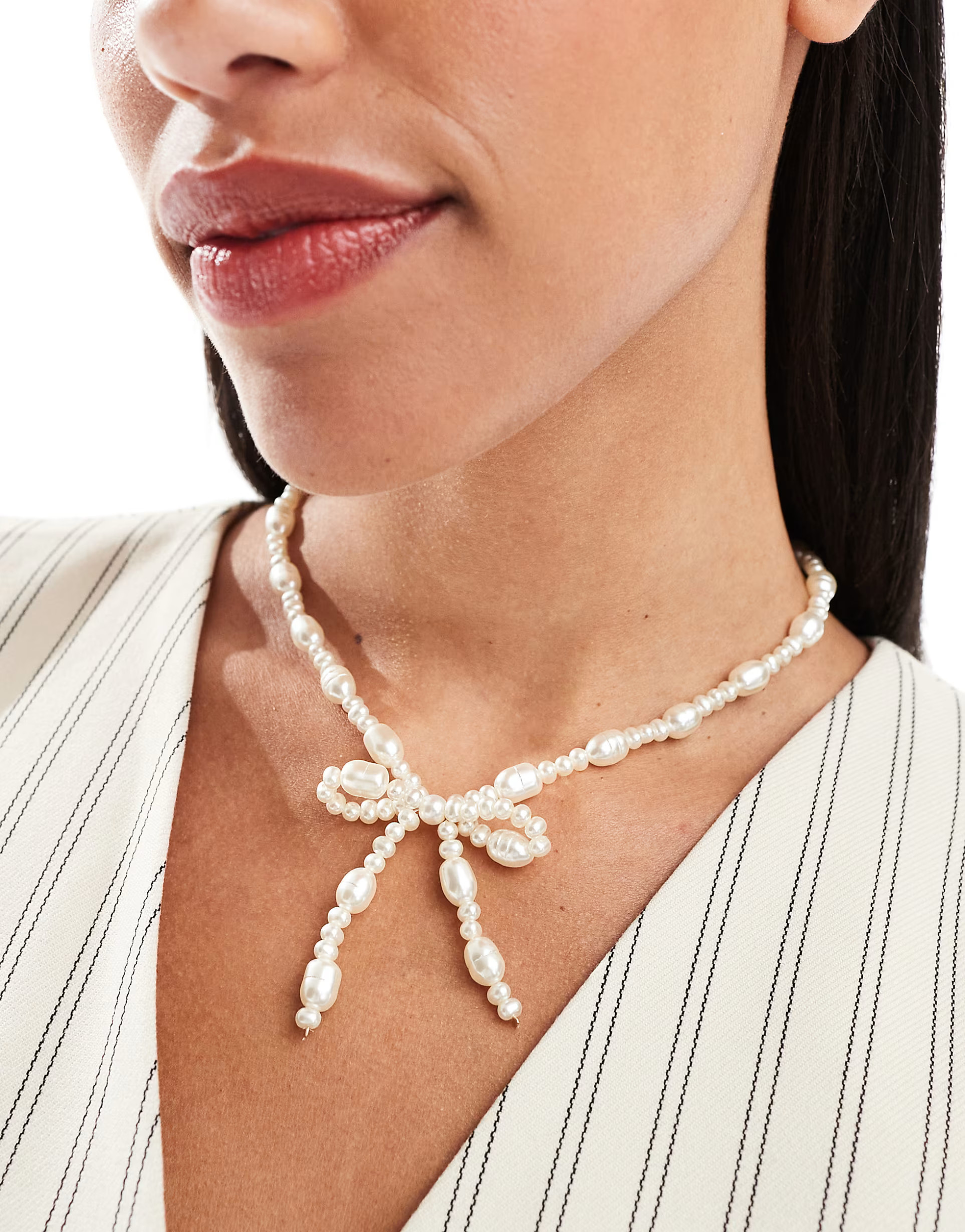 ASOS DESIGN necklace with faux freshwater pearl bow design | ASOS (Global)