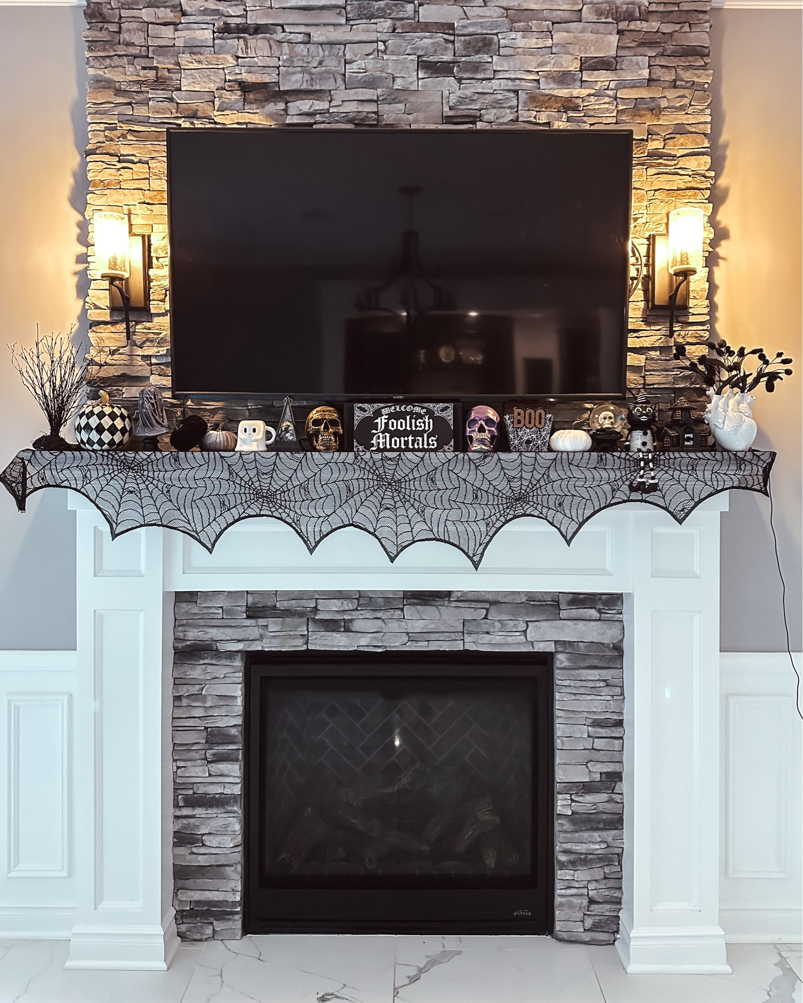 More halloween decorations for our spooky party. The fireplace mantle is one of my favorite parts of our home to decorate. 

#LTKHome #LTKFindsUnder50 #LTKHalloween