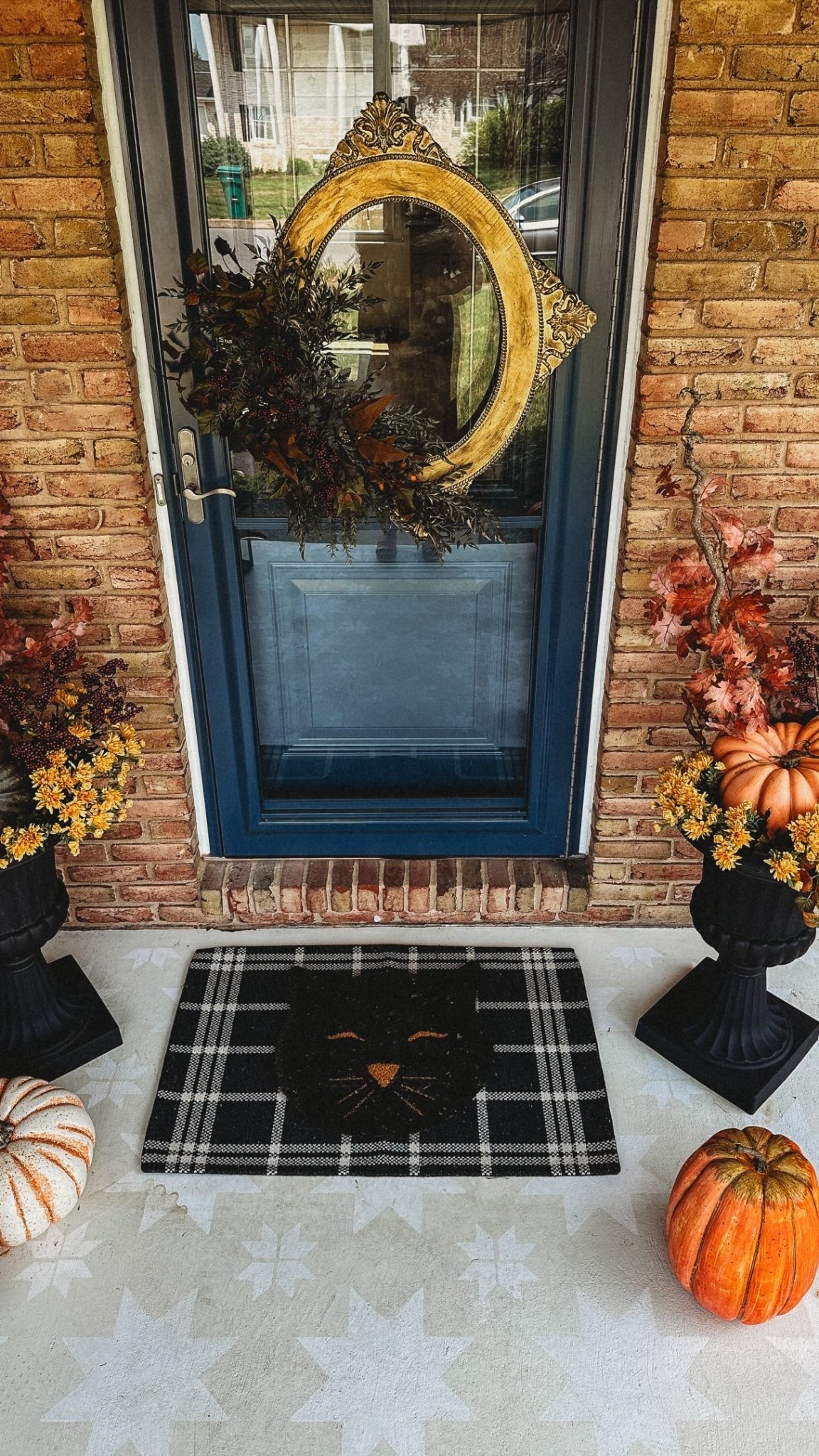 Turn any old picture frame into a WREATH for your door! I painted my frame gold before adding black paint to the ornate details for depth. I wired and glued my fall stems to the lower left quadrant of my frame but you can add florals anyway you like! Is this a thrifted upcycle you’ll try??
