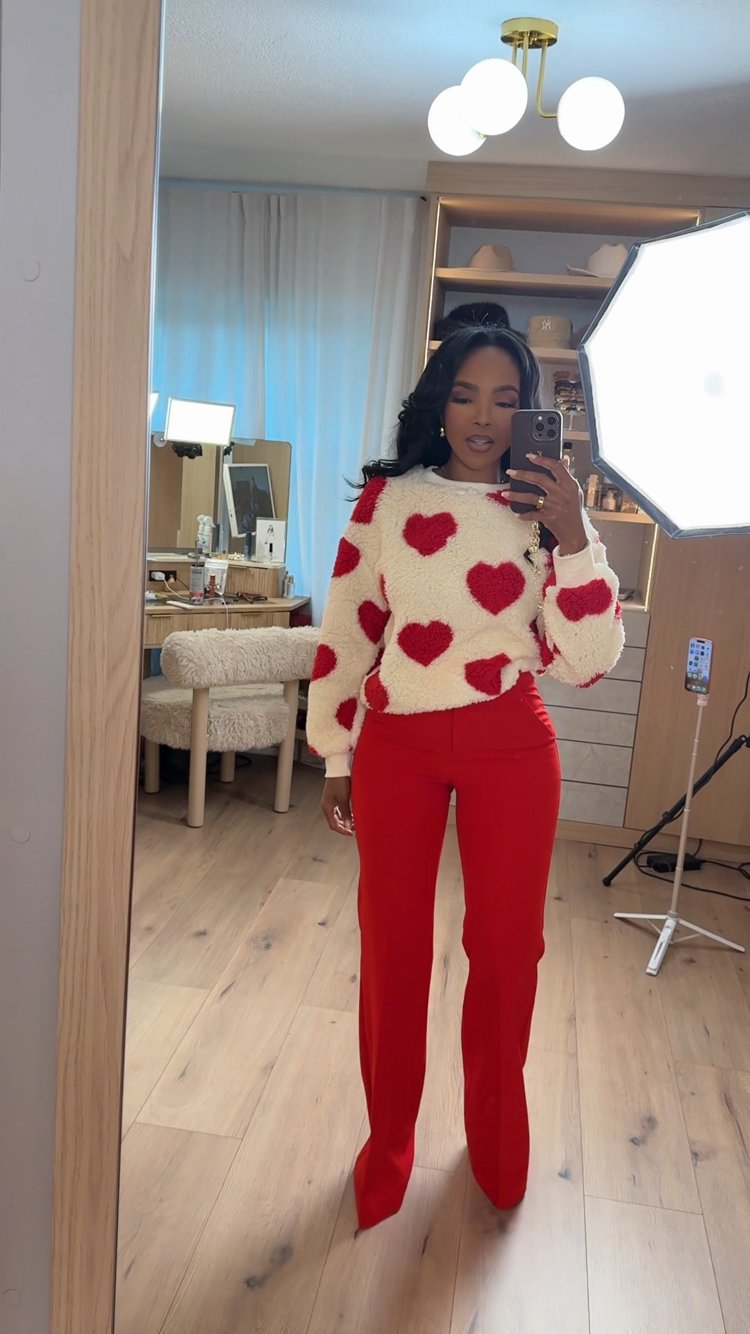 Sweet, playful, and Valentine’s Day ready ❤️✨  
This heart sweater + red pants combo is such an easy way to lean into the holiday without feeling overdone. Cozy texture, bold color, and a flattering fit that works for day or night plans.

Perfect for Valentine’s brunch, a casual date night, Galentine’s plans, or festive errands.

📏 Sizing:  
Sweater — size Small  
Pants — size 4 Long  

Tap to get details and shop this look on the @shop.LTK app.

Follow me on Instagram and YouTube @kirasfashionfinds