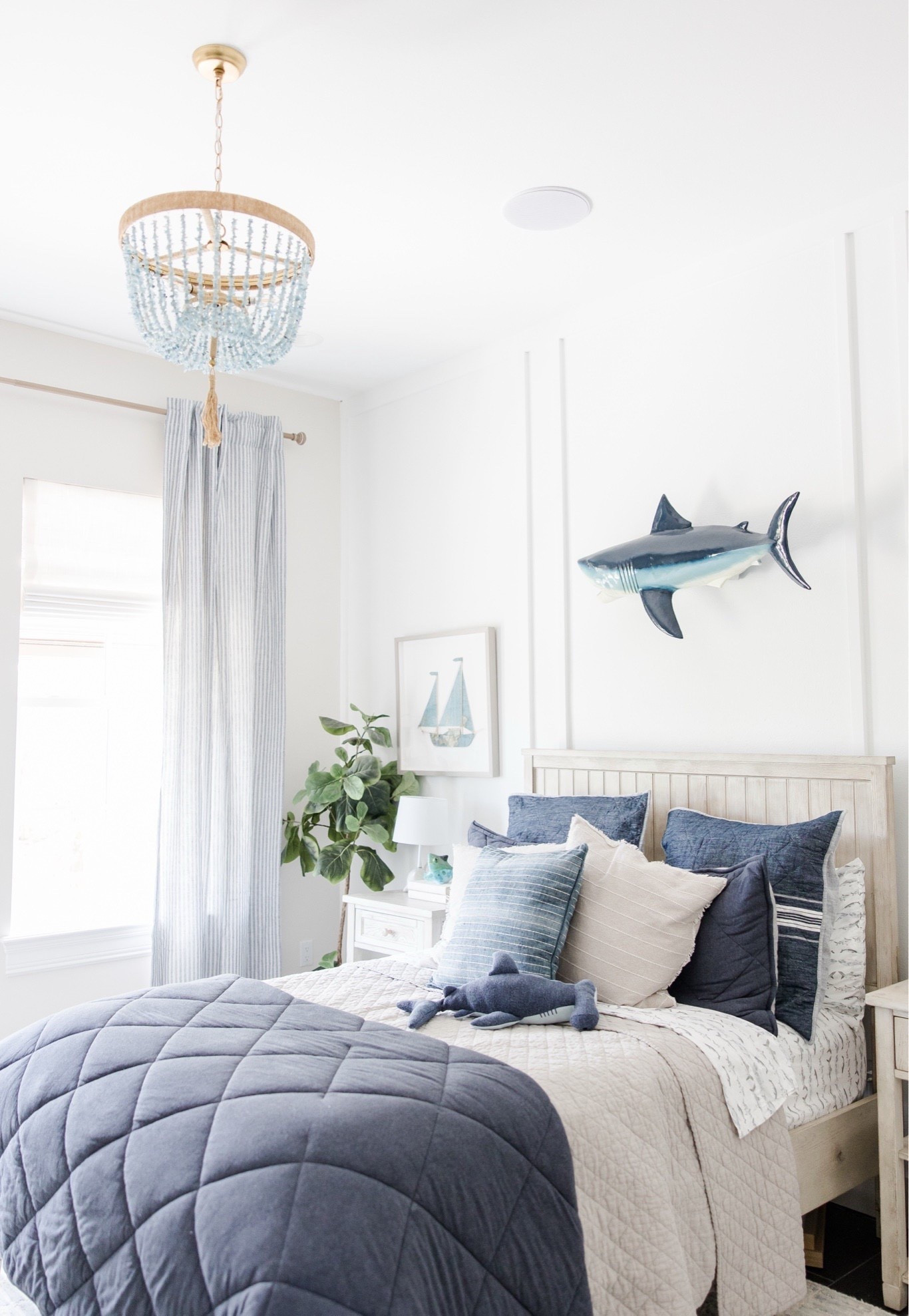 Neutral boys room and you can replace the shark (and light fixture) with as they mature. 

#LTKmomlife #LTKKids #LTKHome