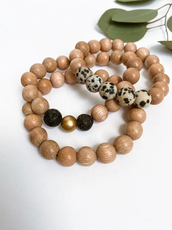Three rosewood bracelets (solid, leopard, gold/black) | Etsy (US)