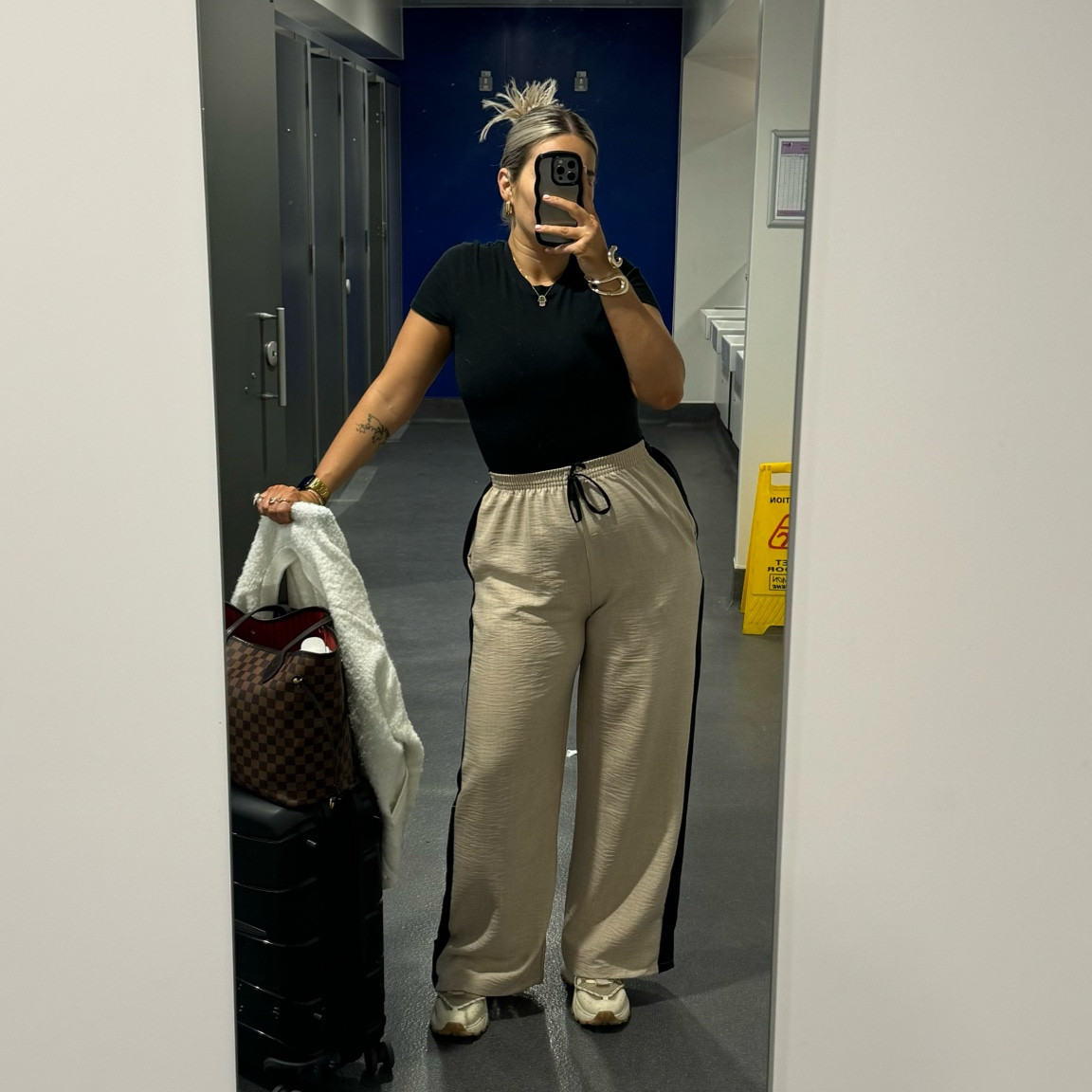 Airport outfit - comfort is key! Wide leg tailored trousers with black stripe detail and an elasticated waistband, tuckable baby tshirt and a textured v neck cardigan.

#LTKstyletip #LTKtravel #LTKuk