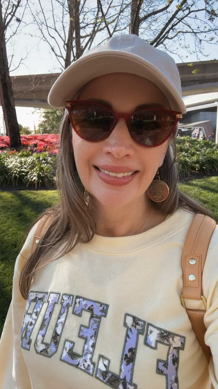 We're starting our day at Epcot! I'm really glad I brought my lightweight sweatshirt; it was a bit chilly at the beginning. It rolls up easily and fits right into my backpack once the sun's out in full force. I've got my sunblock on, and I truly love how it provides natural protection—it's toxin-free! I find baseball caps perfect for shielding my face from the sun. I bought this one years ago, and it conveniently rolls up to store in my lounge fly bag. Of course, I always wear my prescription sunglasses to keep those strong sun beams at bay.
Disney Mom

#LTKTravel #LTKOver40 #LTKmomlife