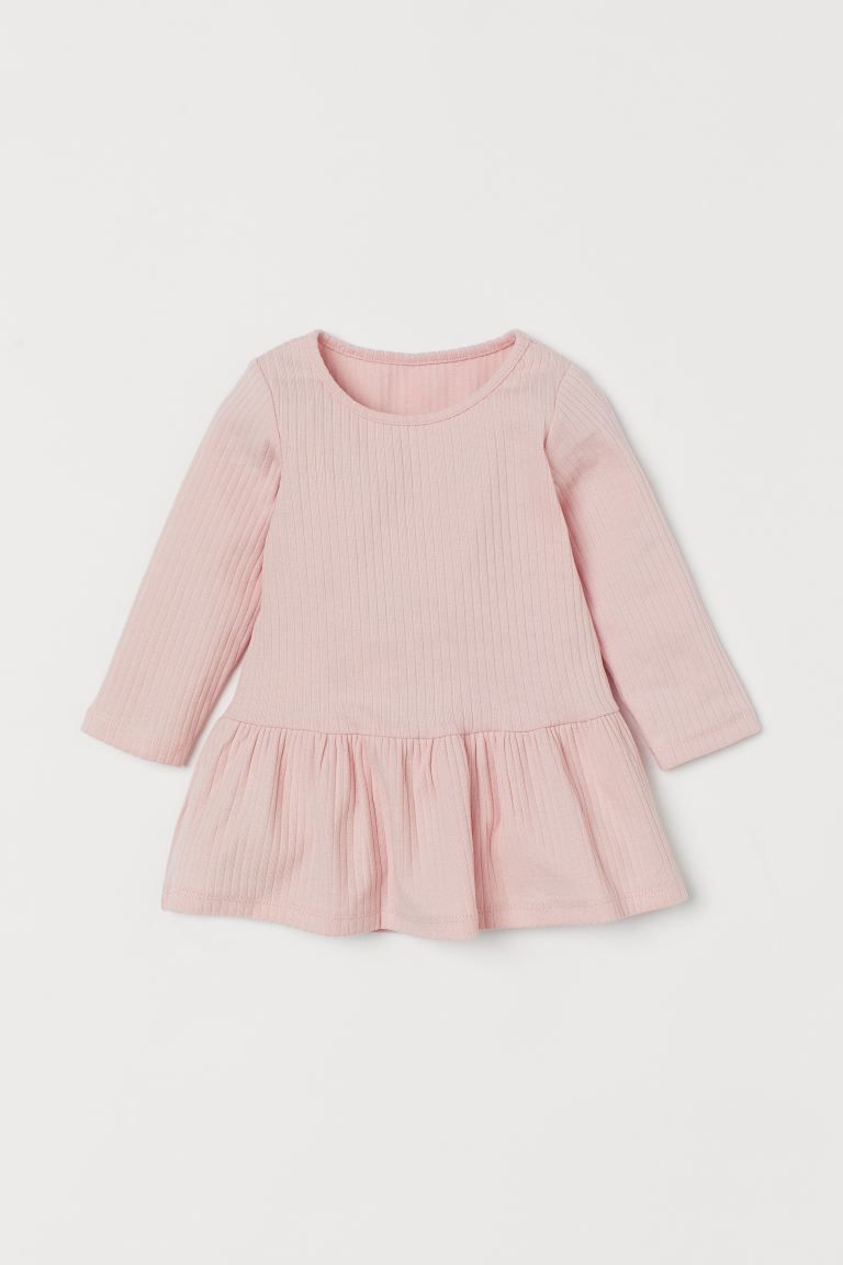 Conscious 
	Long-sleeved dress in soft, ribbed, organic cotton jersey. Seam and wide flounce at h... | H&M (US + CA)