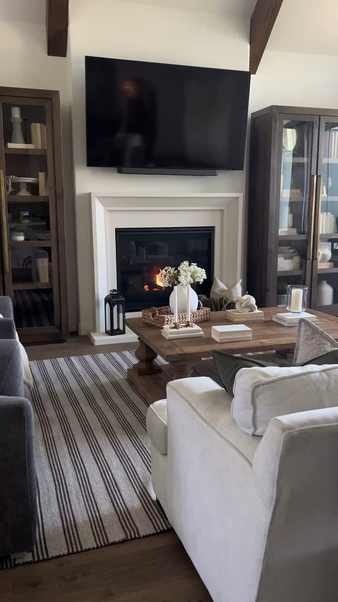 Living room, home interior, rug, tall cabinets, chandelier, dining room, coffee table, accent chair, modern farmhouse

#LTKHome #LTKSaleAlert #LTKdayinmylife