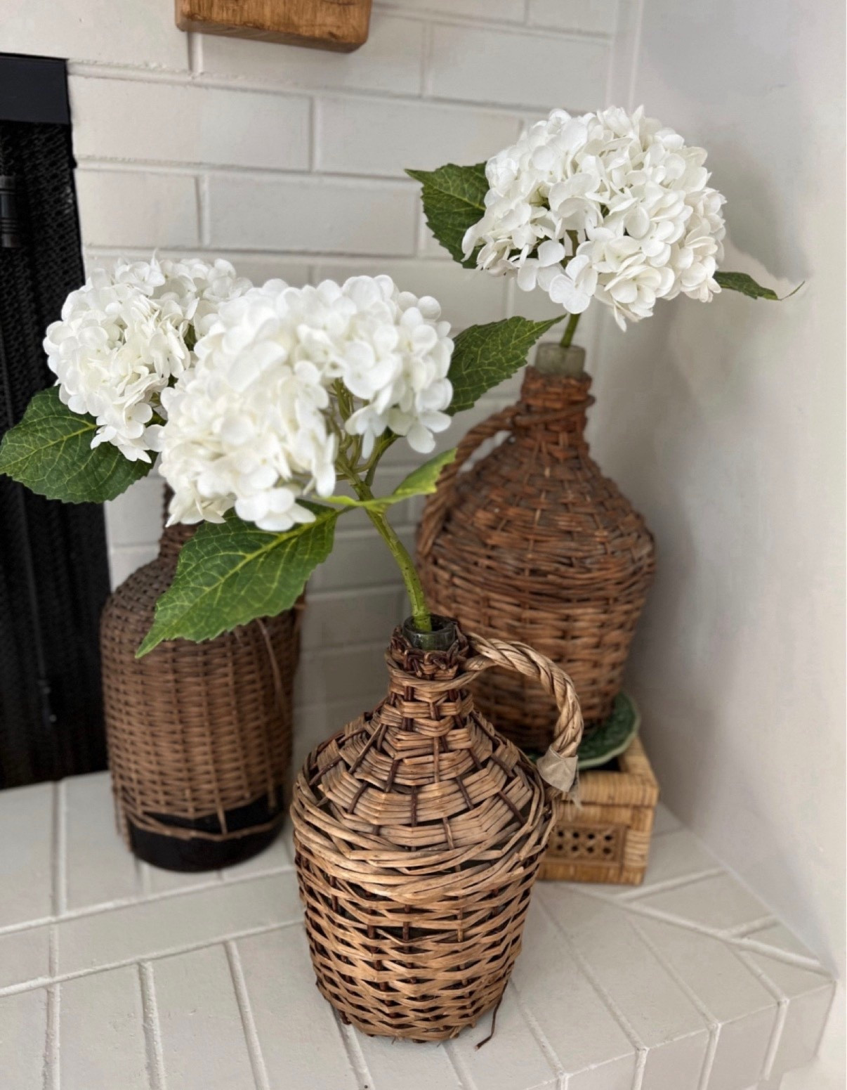 These are the most realistic faux hydrangeas! They are so pretty and go with any type of decor! You can also shop similar wicker demijohns to the ones seen in this picture  


#LTKFindsUnder100 #LTKSeasonal #LTKHome