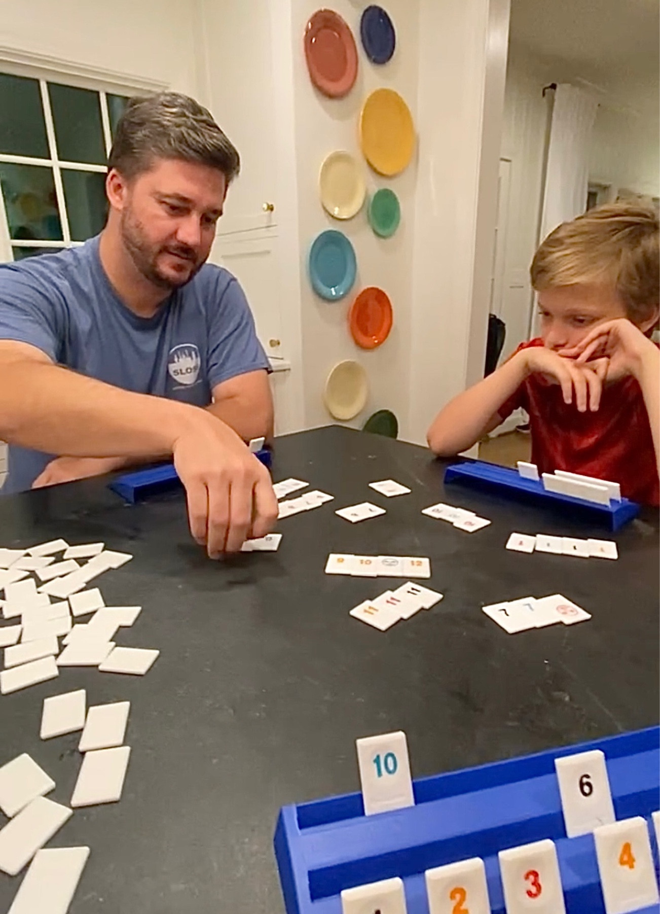 Recognize this game? It’s Rummikub! So fun! 2-4 players. It involves strategic thinking and problem solving skills. You take turns drawing tiles from the pool of tiles or picking up tiles from the table. If a player cannot make a valid play, they must draw a tile from the pool. The first player to go out wins the game.

#LTKhome #LTKfamily #LTKGiftGuide