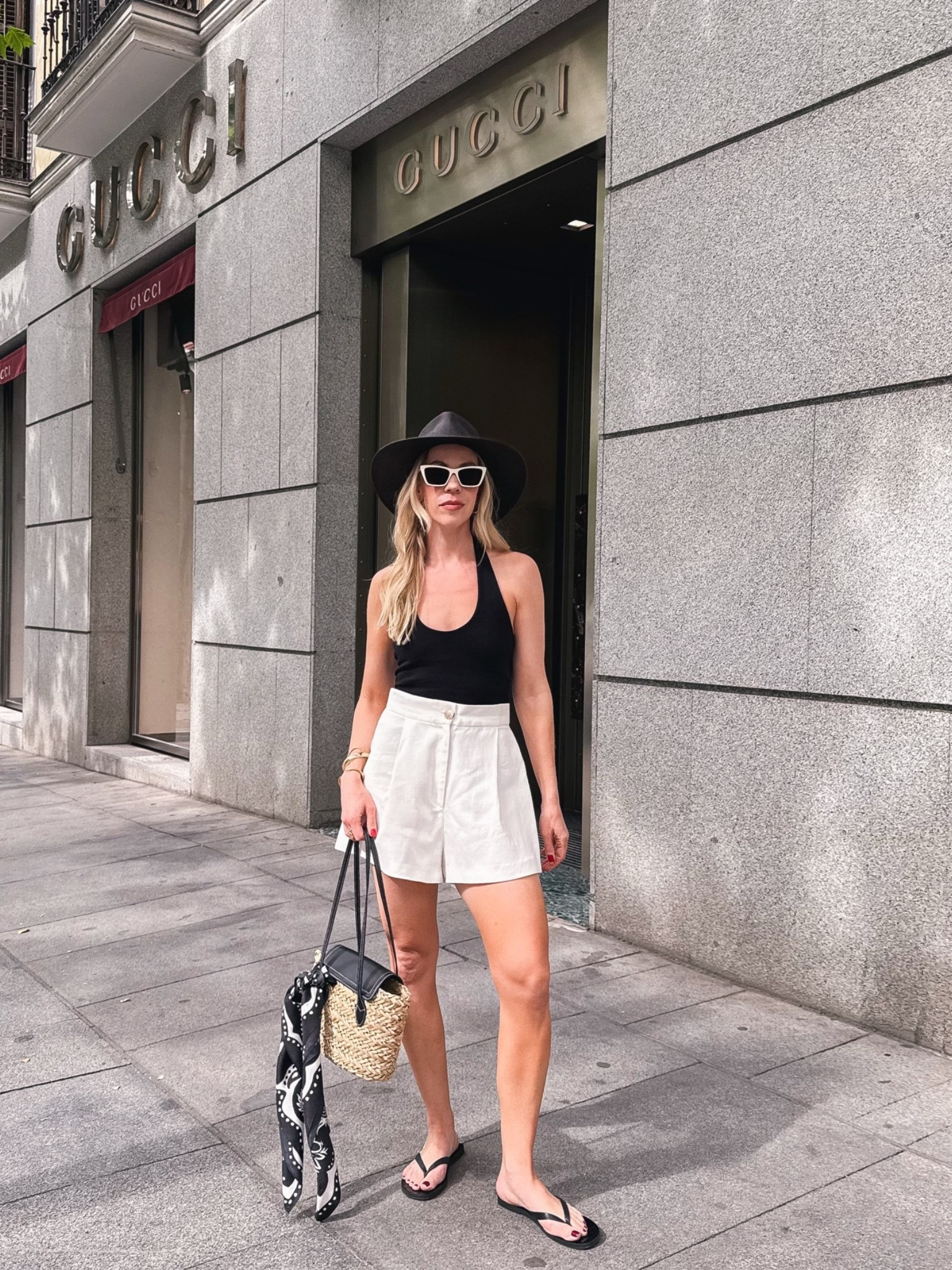 Black and white summer outfit, European summer, black halter top, white linen shorts, leather thong sandals, straw tote bag, @Janessa Leone straw hat

#LTKTravel #LTKSeasonal #LTKSaleAlert
