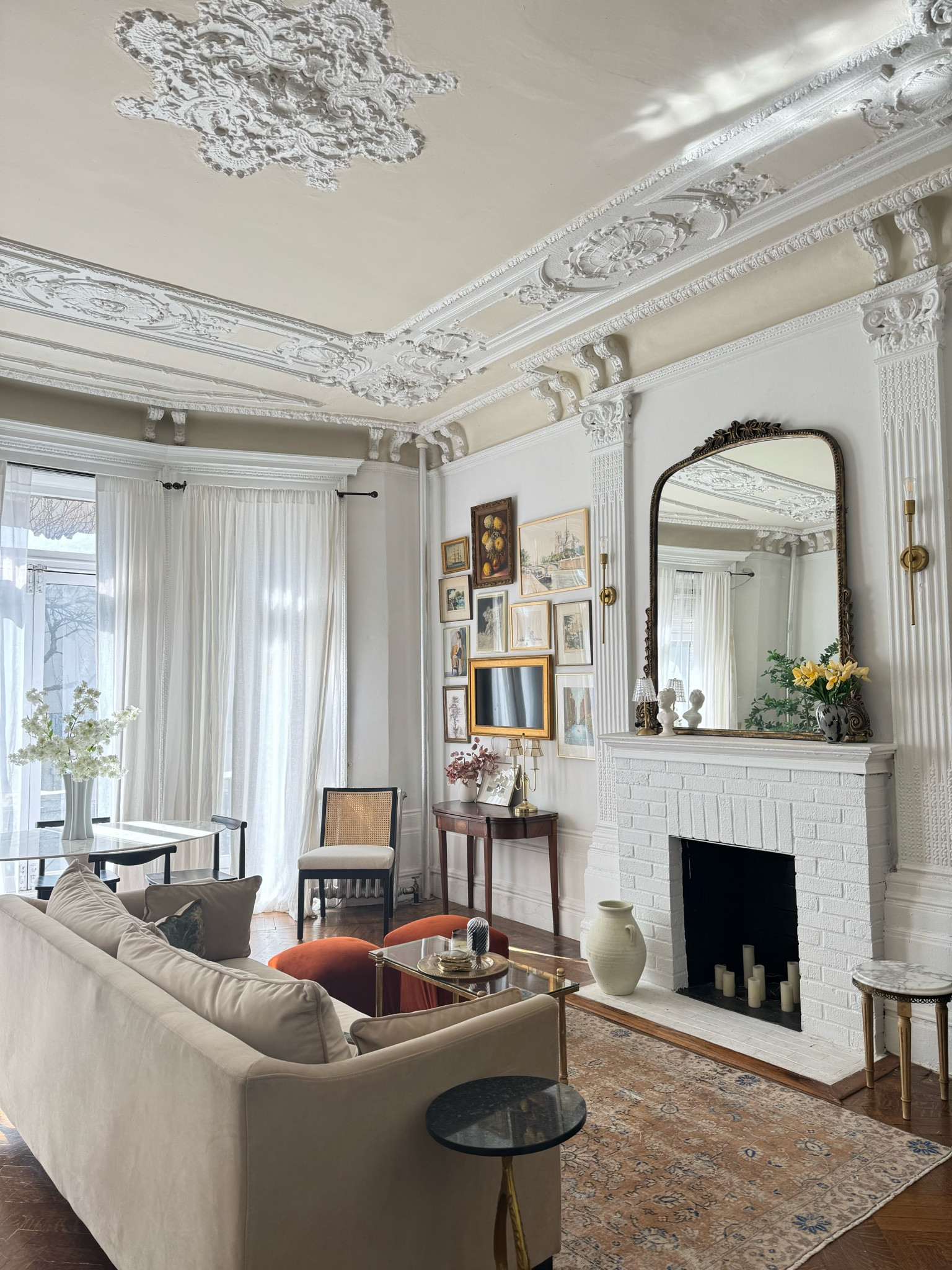 Studio sources- velvet sofa, small glass coffee table, ottoman, mantel mirror, sconce, dining chair 

#LTKhome #LTKstyletip