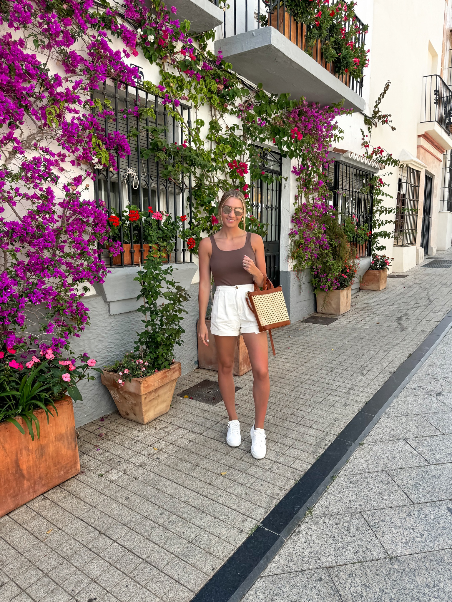 A beautiful day in Spain complete with the most comfortable sneakers for walking all day! Also, this bag is perfect for travel with the arm bag straps and a longer crossbody strap that detaches. It also zips closed which is perfect to keep your things secured. Highly recommend! 

#LTKTravel #LTKShoeCrush #LTKItBag