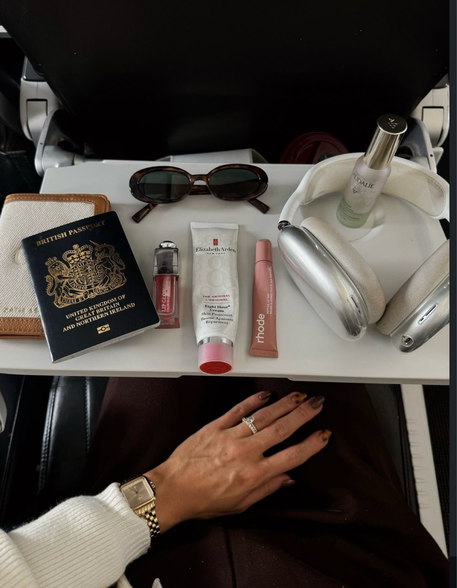 Plane essentials, travel essentials, air pod max, Dior lip gloss, rhode peptide lip tint, Elizabeth Arden hand cream, caudalie, les specs sunglasses 

#LTKtravel #LTKuk #LTKbeauty