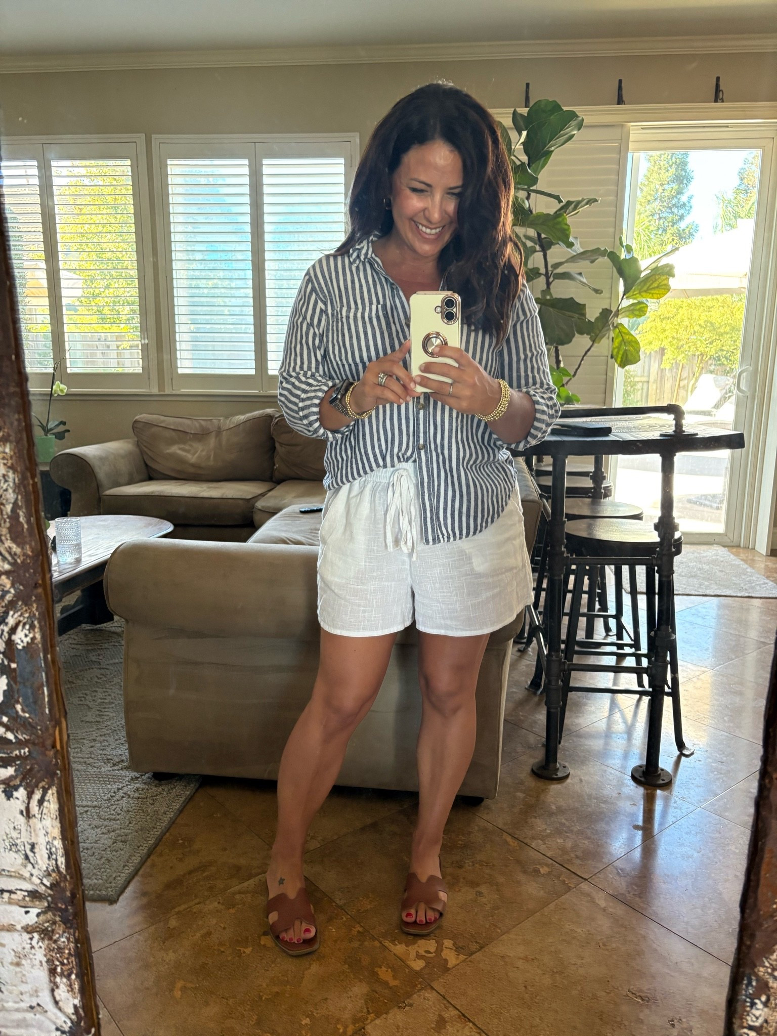 Easy summer outfit that always works 🤍☀️ This striped linen button-down + white linen shorts combo is lightweight, polished, and perfect for everything from brunch to backyard dinners. I finished it with my favorite brown slides and simple gold jewelry.

#LTKootd #LTKSeasonal #LTKPetite