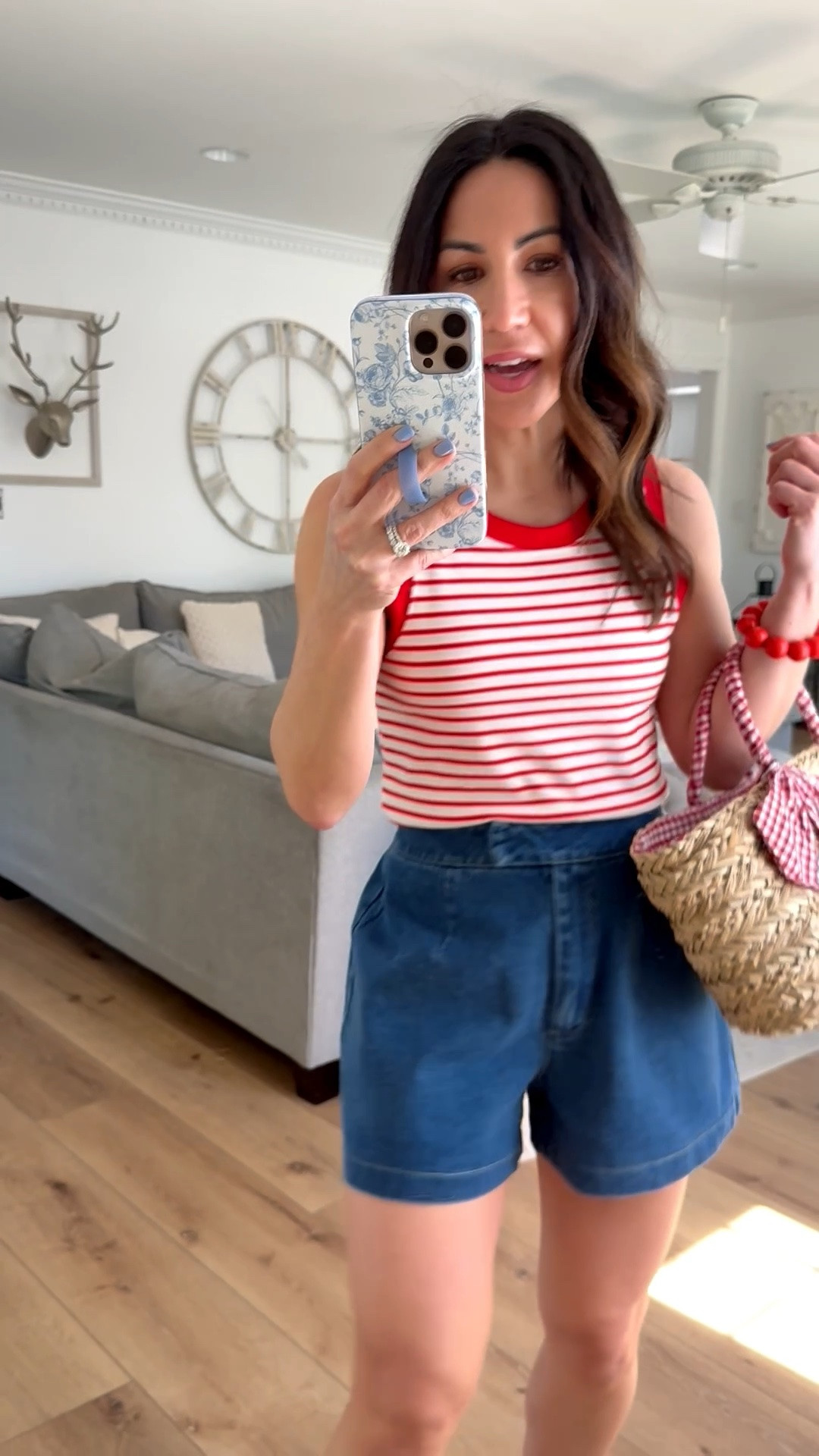 Wearing small denim shorts. Small striped tank top.

#LTKOver40