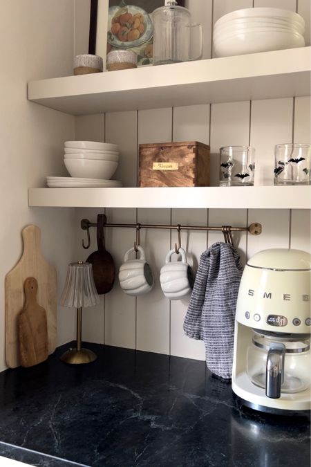 Kitchen shelves decorated for fall with white pumpkin mugs 

#LTKSeasonal #LTKhome #LTKHalloween
