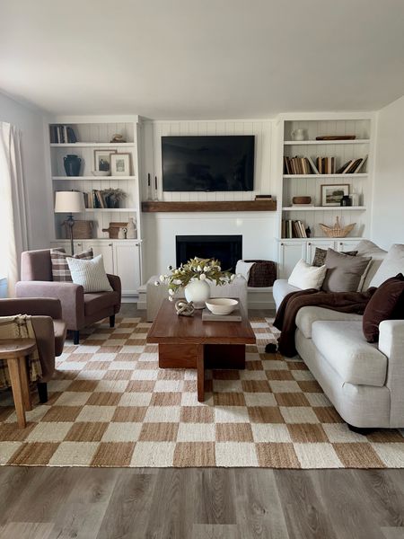 Spring living room decor, Target decor, Jute rug, checkered rug, grey couch, wood coffee table, rectangle coffee table, brown accent chairs, spring florals, neutral living room decor 

#LTKfindsunder100 #LTKhome #LTKSeasonal