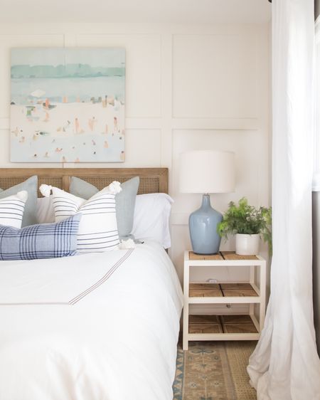 All the spring decor vibes in our guest bedroom! I’m loving the combination of this cane bed frame, woven nightstand, blue gray ceramic lamp, beach art, faux fern and hand-knotted rug! It pairs perfectly with these Pottery Barn and Serena & Lily pillows! 

. coastal decor, coastal design, neutral decor, blue and white decor

#ltkhome #ltksalealert #ltkseasonal #ltkunder50 #ltkunder100 #ltkstyletip #ltktravel #ltkfamily #LTKSeasonal #LTKsalealert #LTKhome

#LTKsalealert #LTKSeasonal #LTKhome