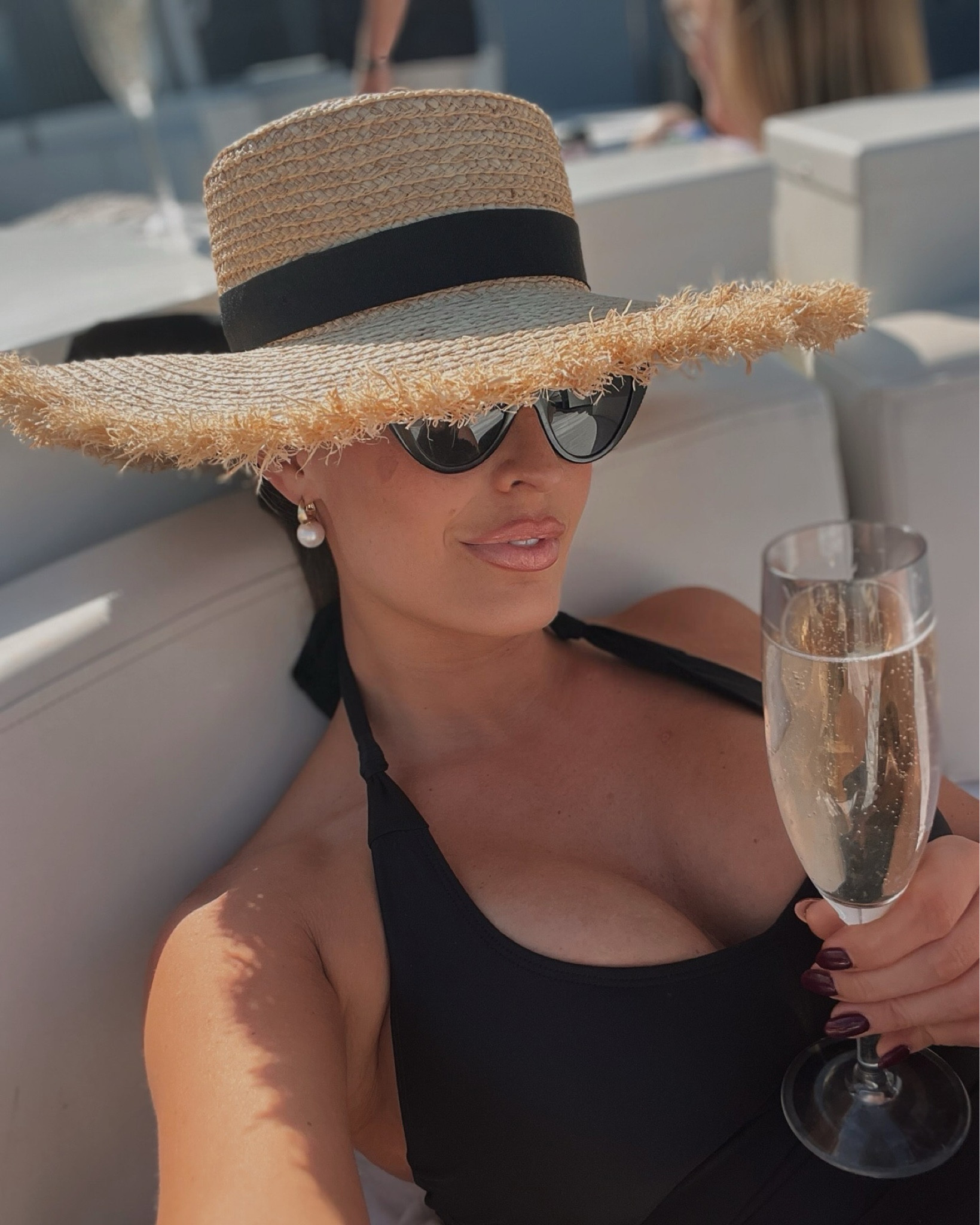 Sunbathing essentials 🖤 Cat eye sunglasses, halterneck bathing suit & a raffia hat with pearl earrings

#LTKstyletip #LTKtravel #LTKswimwear