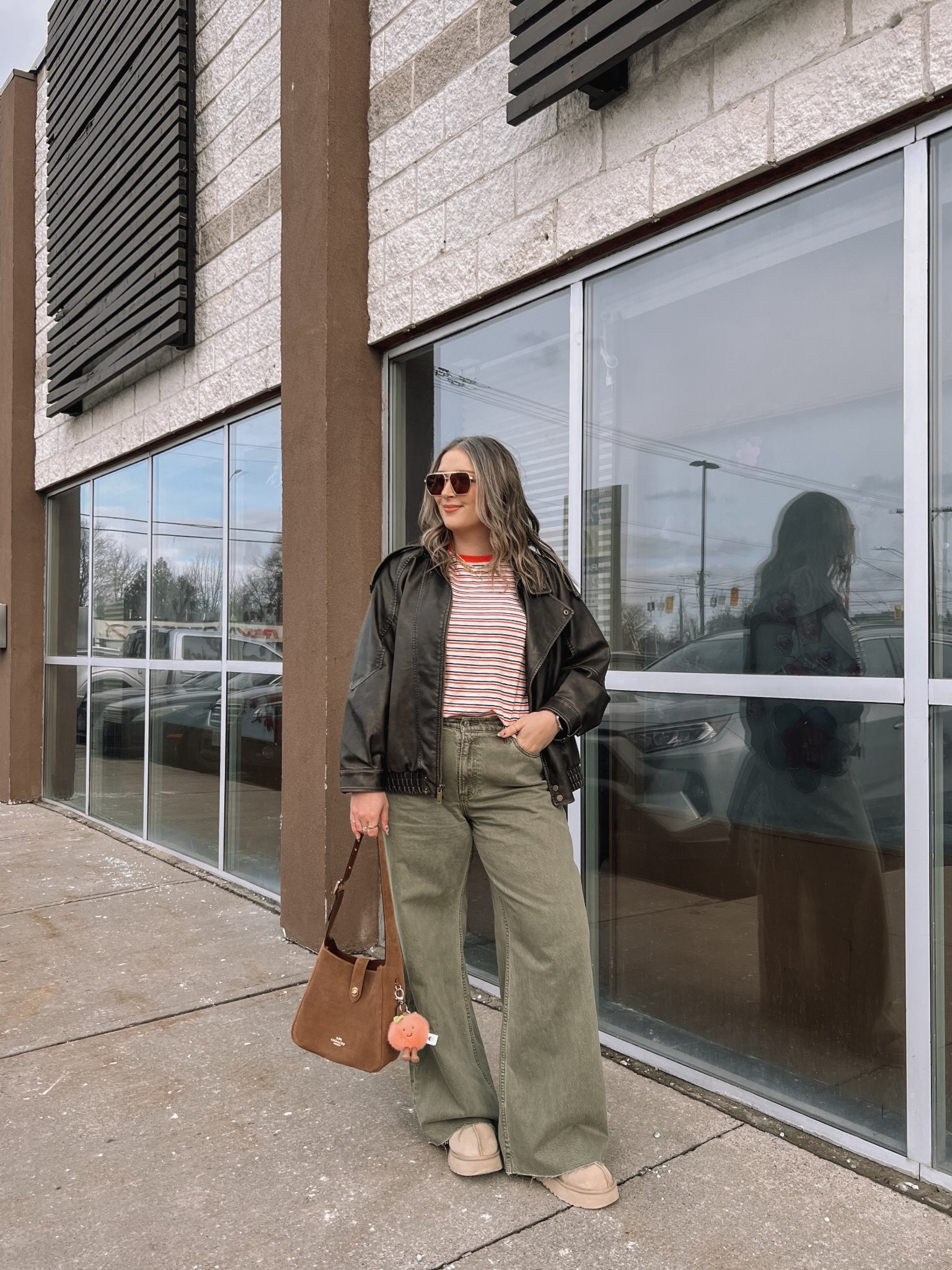 Easy spring outfit! Wearing my usual size L in the leather jacket. Sized up to XL in the striped tee since I have a larger chest and didn’t want it tight. Wearing 32 long in the olive jeans (the long length was a bit too long for me, reg was too short, so I cut the hem for a custom length! Ugg Tazz platforms fit TTS. I wear this coach bag constantly, and the jellycat peach bag charm is so fun for spring!


#LTKjeans #LTKmidsize #LTKstyletip