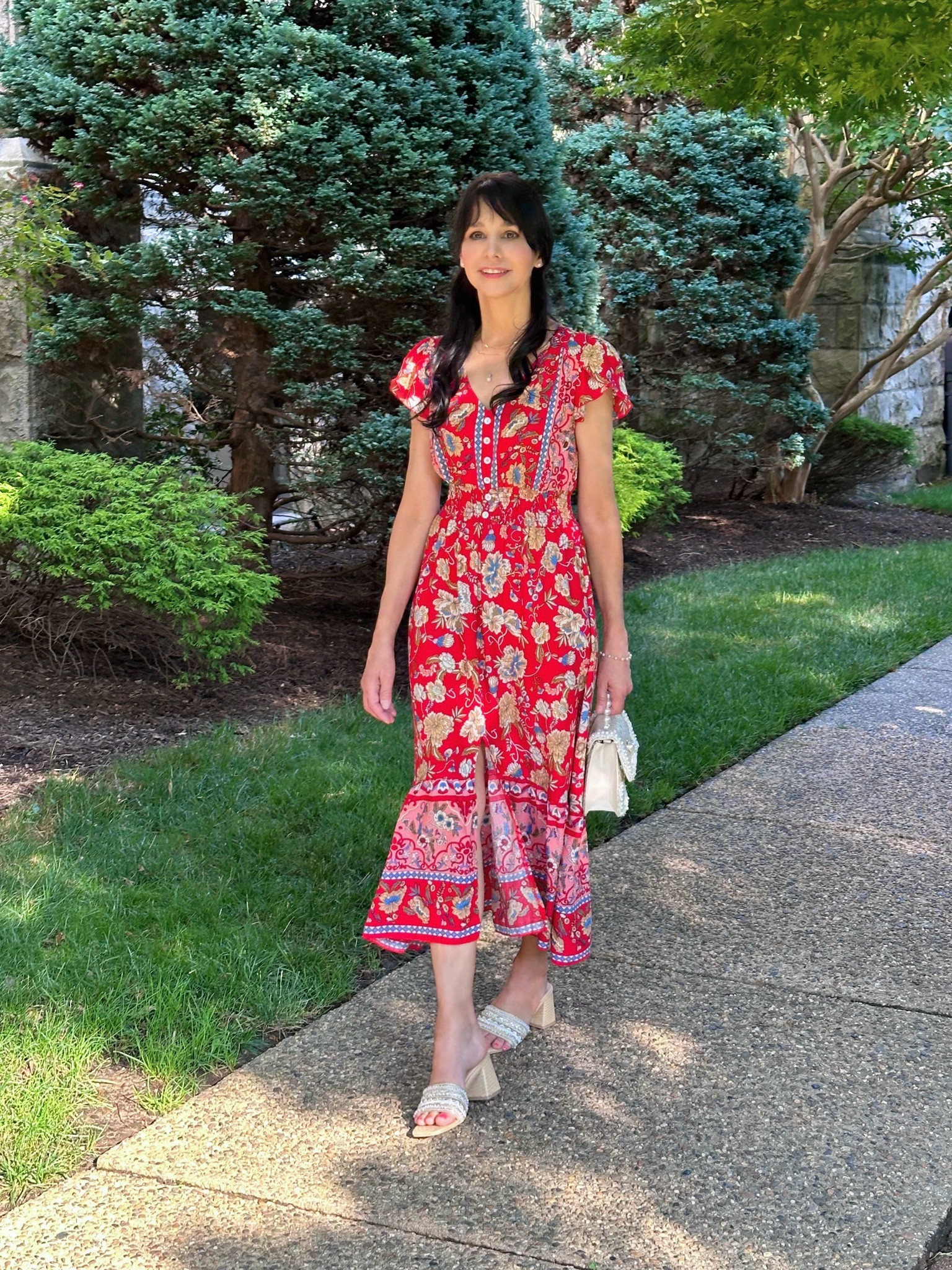 Just here enjoying each day of summer fashion! I just love the softly shirred comfortable waist, the colors/print/border, and the light petal sleeves of this pretty dress! I loved the style so much that I ordered it in another color combo! 
Paired the dress here with a pair of beautiful embellished slides, pearl trimmed bag, and delicate pearl and gold jewelry pieces!