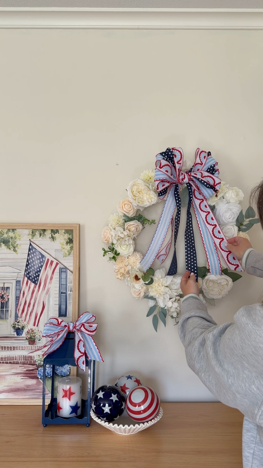 HOW easy is this?! I used this bow trick a lot at Christmas but when I saw this absolutely adorable ribbon @Michaels I had an idea to do a layered version and it came out so well! 

All you do is tape two butter knives (or another sturdy long object) to the edge of a table, about 6in apart, drape your ribbon over the top, fold it under and over the top again, cross the tails under the ribbon,  bring one tail over the ribbon and tie the two tails together. Then fan out the layers and zhuzh it up! 

I added my ribbon to a wreath I made with a pool noodle and hung it next to my fave new decor pieces (also from Michael’s!) I’m obsessed and can’t wait to try it with more ribbon! 

#LTKHome #LTKSeasonal