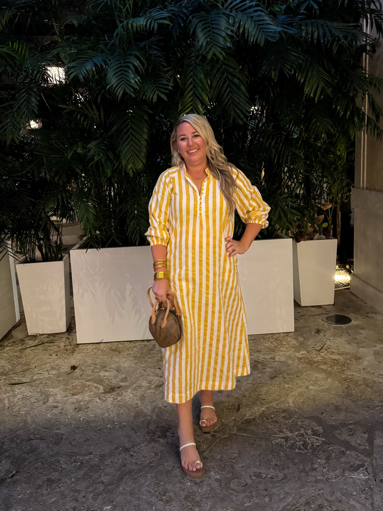 Last night’s resort wear look was this yellow and white striped linen dress from Tuckernuck! I love the button detail along the neckline. I’m 5’9” and tried both the L and XL, and the XL fit better in my shoulders and chest area. Shoes fit true to size and are a great designer look for less! #ltktravel #ltkover40 #ltkmidsize #ltkshoecrush #ltkitbag #ltkfindersunder50 #ltkstyletip 

#LTKTravel #LTKOver40 #LTKMidsize