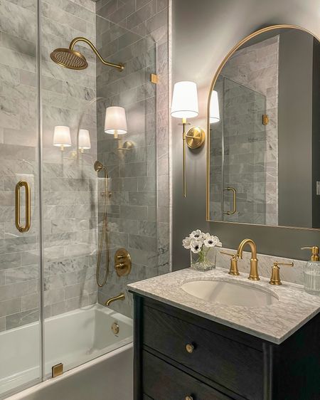 Gray and gold bathroom decor. All these brushed gold finishes match really well together! And the fixtures are Amazon! 🙌🏼

#LTKhome #LTKstyletip #LTKfindsunder100