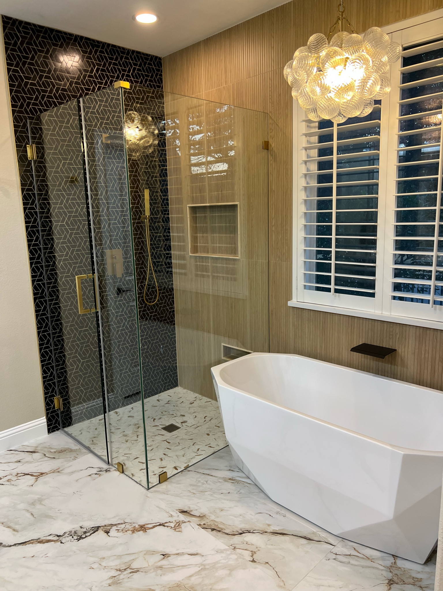 Master Bathroom Renovation!! Linked as much as I could, listed anything not on LTK below:

Black Tile: Floor and Decor: Maravilla JET BLACK BASALT PINION MOSAIC (linked similar)

Brown Wall Tile: Floor and Decor, Dimensions Ribbon Oak Ceramic Tile (linked similar)

Floor: Floor and Decor, Dorado Blanco Porcelain Tile

#LTKHome