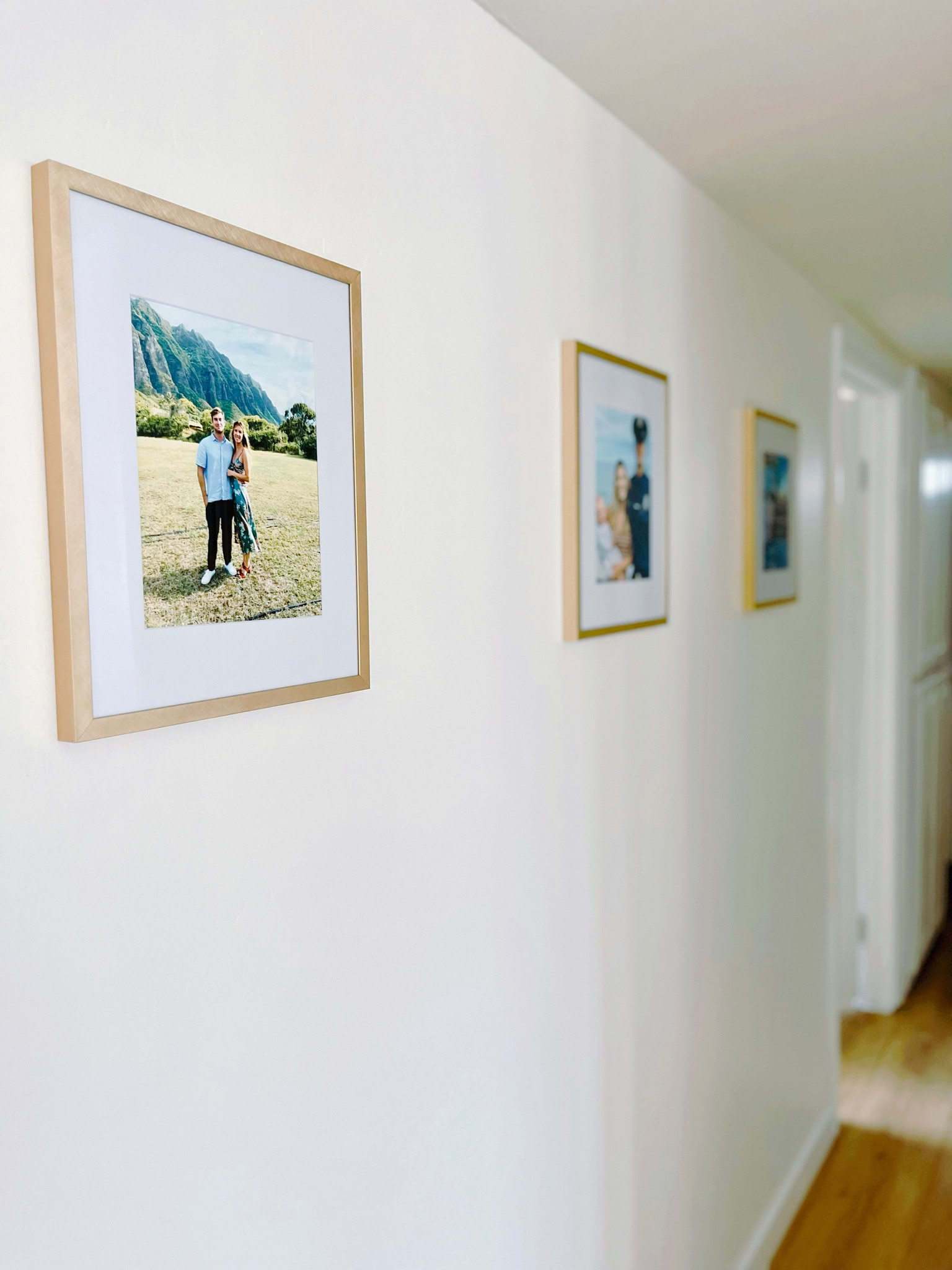 Hallway photo collage 

#familyphotos #hallwaydecor #californiahome #goldphotoframe #bohodecor

#LTKhome #LTKFind #LTKfamily
