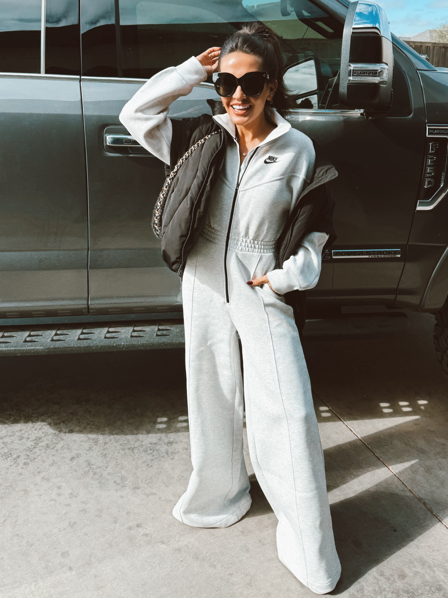 Nike jumpsuit in XS and black puffer vest 

#LTKstyletip