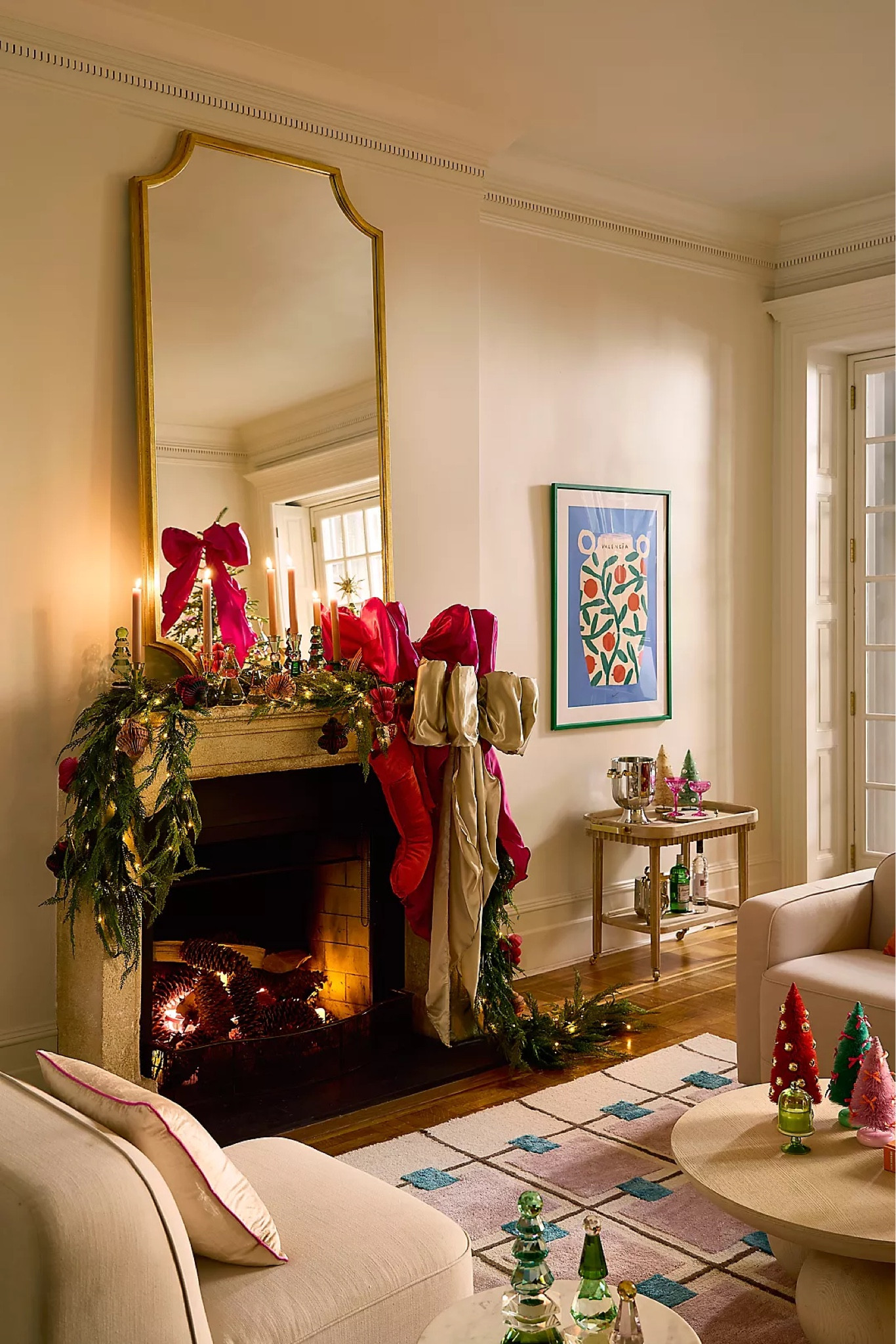 New from Anthropologie—-a gold framed mirror that makes the statement, create illusion of the space and reflect your holiday decorations. #mirror #homedecor