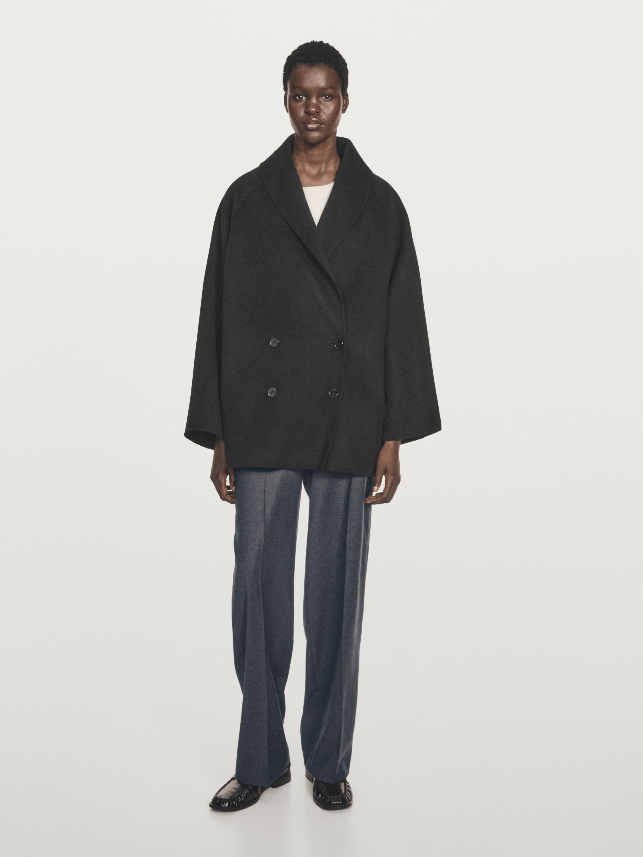 Mid-length wool blend coat. Lapel collar. Raglan sleeve. Double-breasted button fastening at the ... | Massimo Dutti UK