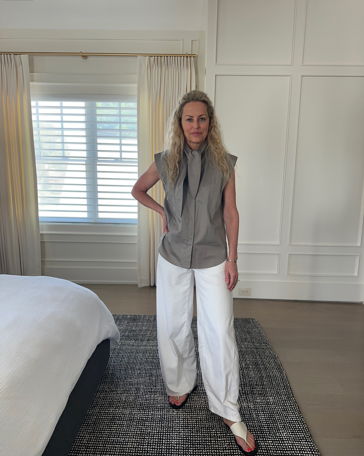 Fresh white loose leg jeans and a crisp tie blouse. Casual but elevated.

#LTKootd #LTKOver40