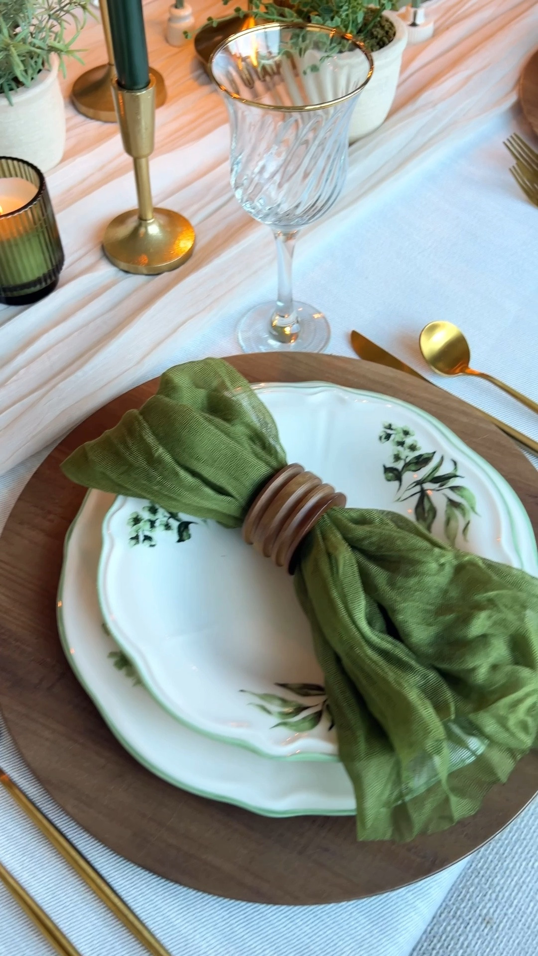 Layered green and neutral tablescape featuring scalloped floral dinnerware, soft linen napkins, natural wood textures, gold flatware, and fresh greenery for an elevated everyday table.

Green floral ceramic plates, scalloped dinnerware set, Bella Maison dishes, salad plates, soup bowls, ceramic serveware, neutral linen napkins, olive green napkins, gauze table linens, wooden napkin rings, round wood tray, wood serving board, fresh limes decor, citrus styling, gold flatware set, gold utensils, brushed gold silverware, ribbed glass goblets, vintage style glassware, clear stemware, tabletop greenery, potted herbs, faux plants decor, neutral vases, modern organic table decor, layered tablescape, everyday hosting table, spring summer table setting, earthy table styling, natural textures home decor, kitchen counter styling, modern hostess table

#LTKHome #LTKSeasonal #LTKfoodie