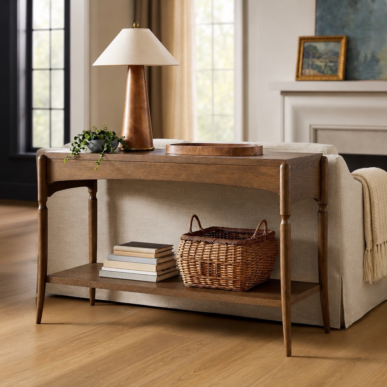 This console table blends timeless design with everyday function. The warm wood tones, turned leg details, and curved apron give it a collected, high-end look, while the lower shelf adds the perfect spot for baskets, books, and decor. A versatile piece that works beautifully behind a sofa, in an entryway, or along a hallway wall 🤎

#LTKHome