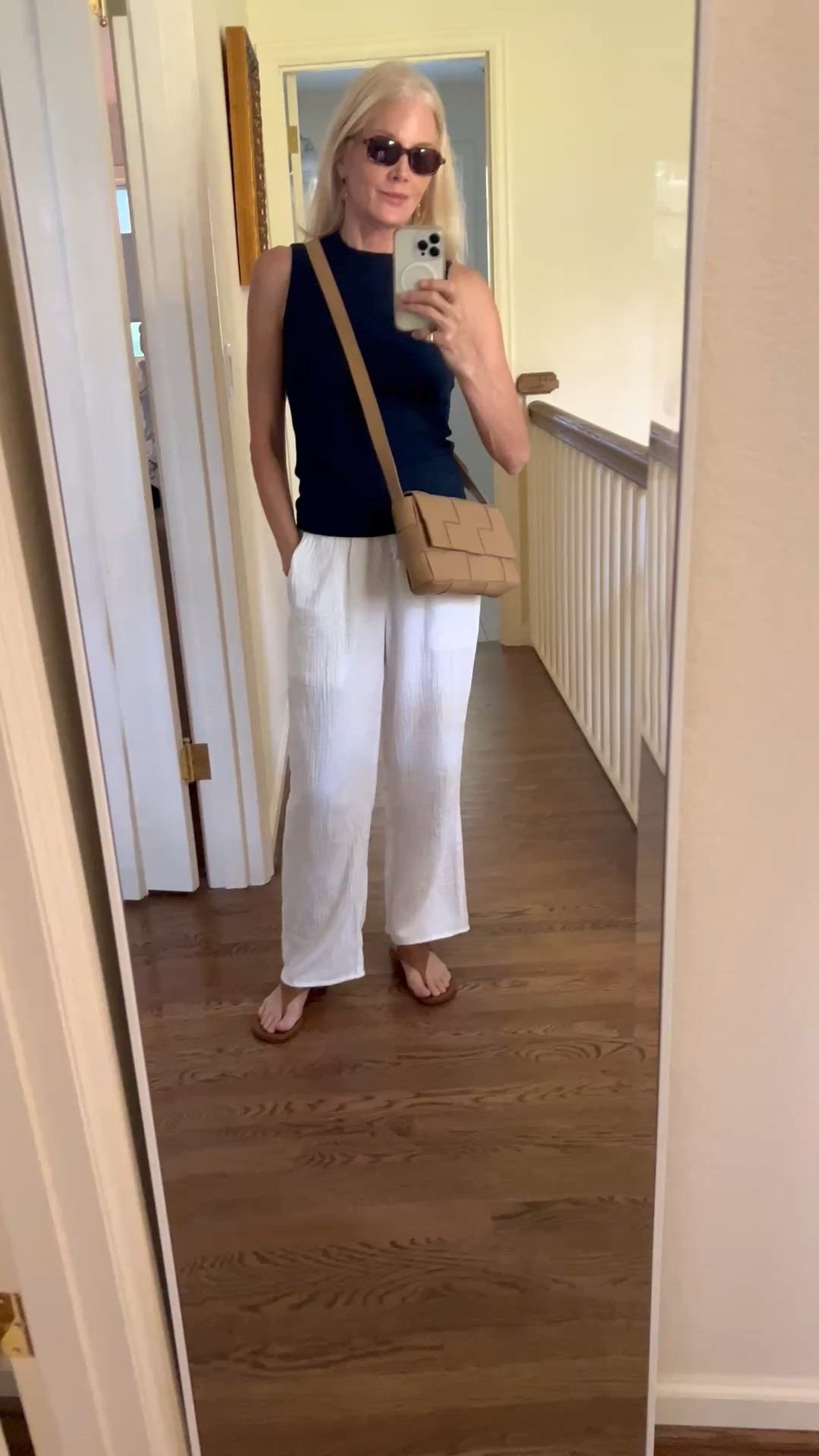 The perfect crew neck sleeveless tee pairs with gauze pants, sandals and a structured, functional crossbody. Dog days of summer!

#LTKxMadewell