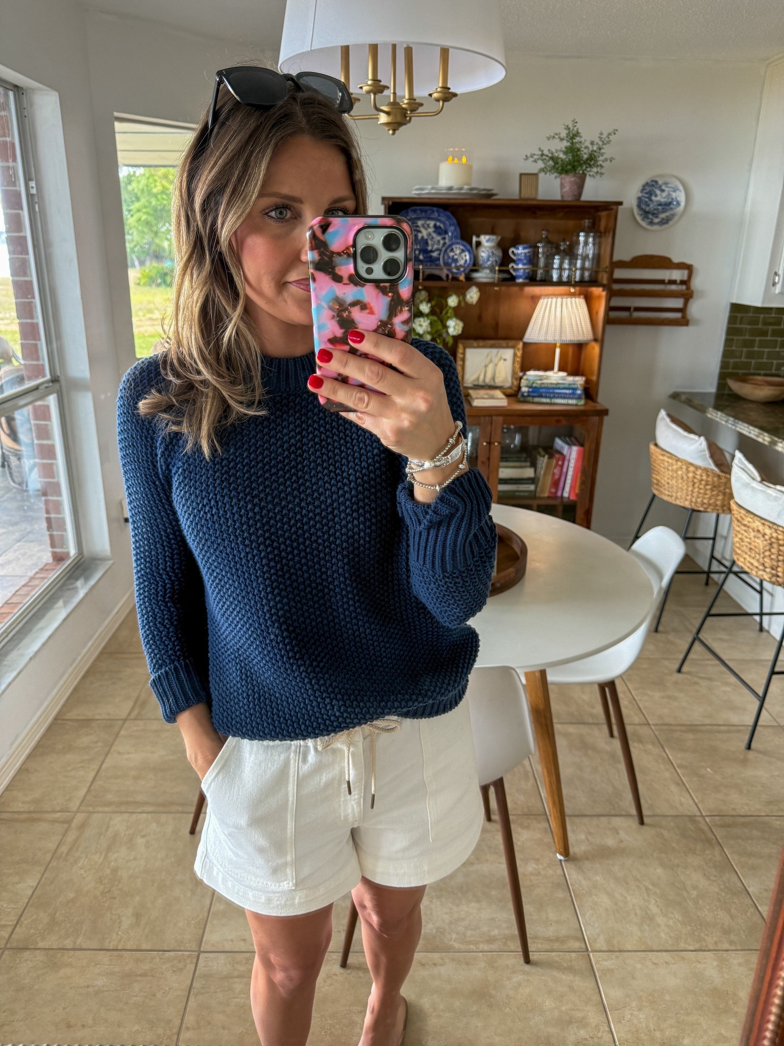 Wearing a small in the shorts, medium in the sweater and large in the navy blue tank top underneath! I highly recommend grabbing the tank top if you purchase this sweater! 

#LTKootd