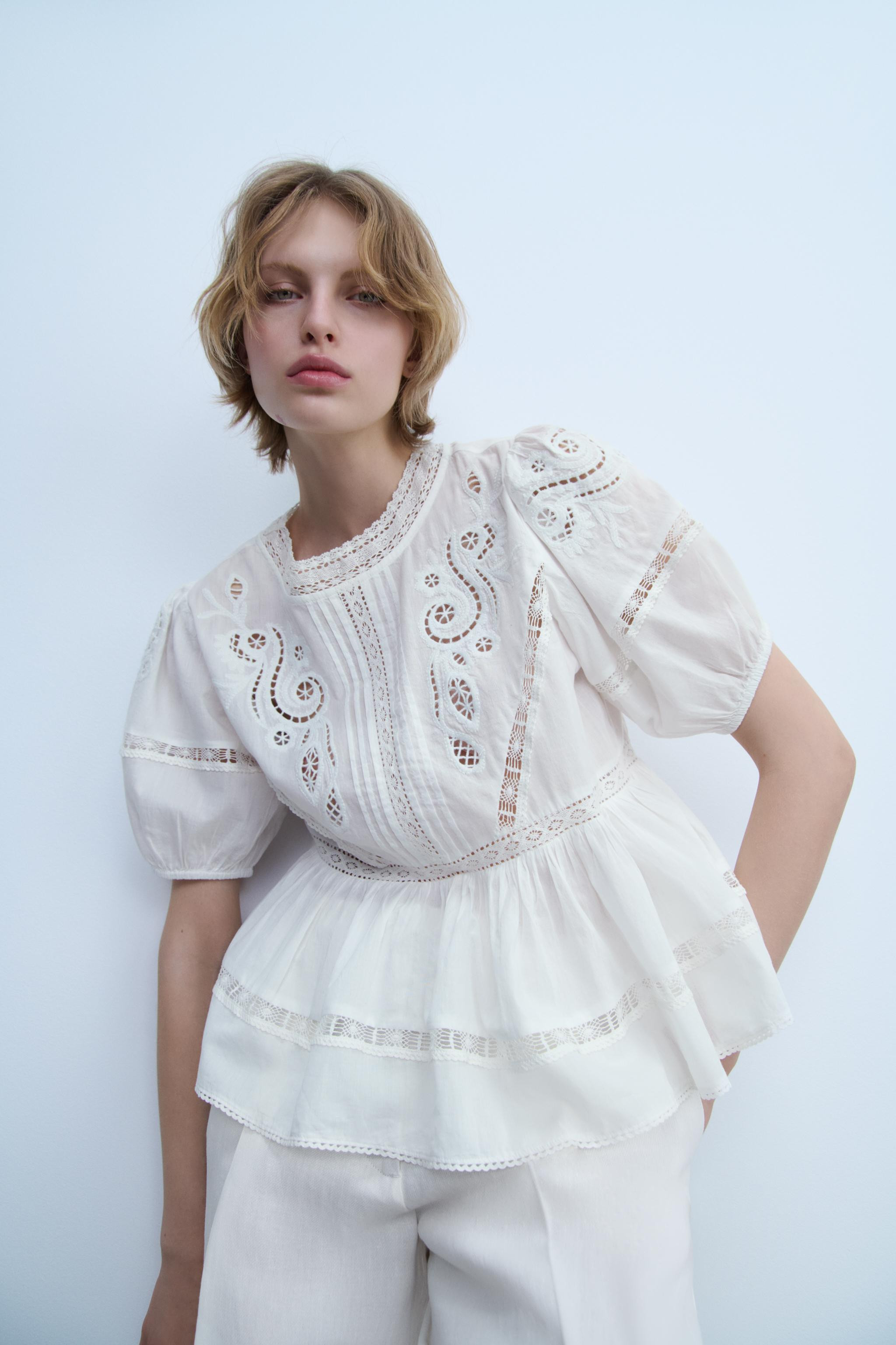 ZARA WOMAN COLLECTIONBlouse made of 100% cotton yarn. Round neck and short sleeves with elastic c... | Zara US