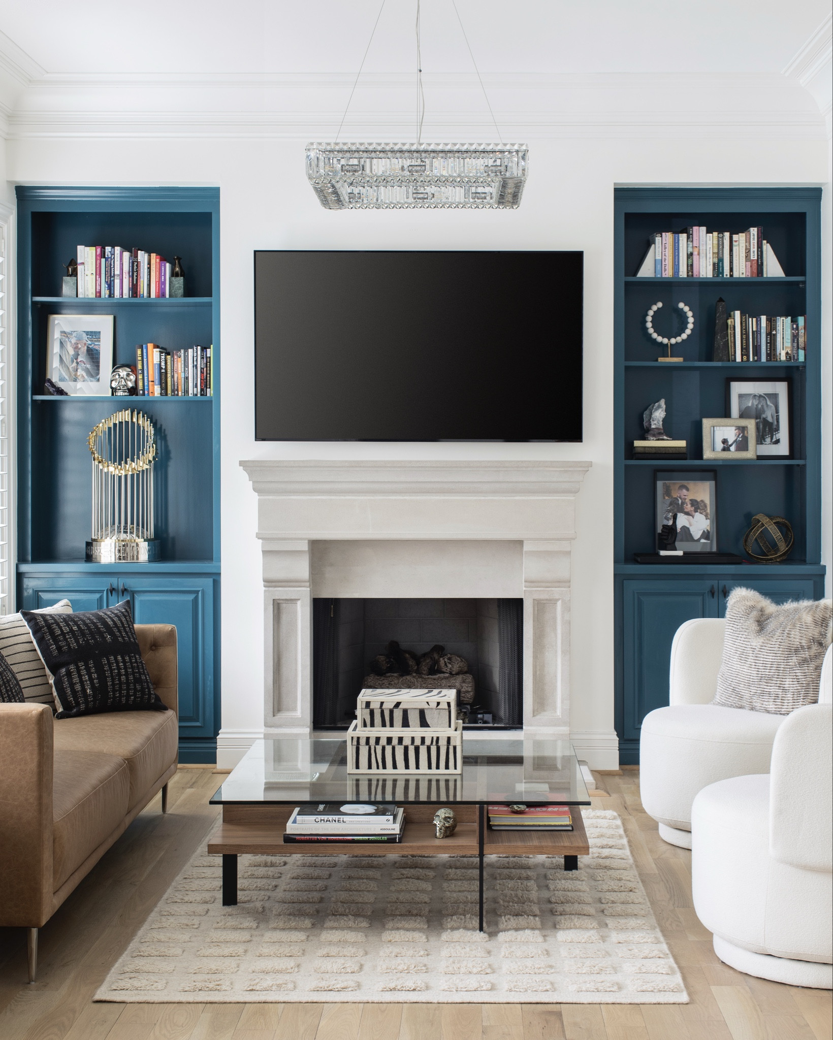 Our version of a “formal living room” is far from it. The built in shelves hold books we’ve read and family photos -  we love to sit in here by the fireplace. The swivel chairs from Urban Outfitters were such a find - these exact ones are no longer on the site but the ones linked are very similar!

#homedecor #crateandbarrel #livingroom 

#LTKSaleAlert #LTKHome