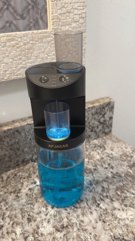 👀This touchless mouthwash dispenser is AMAZING!!! I love how the cups just magnet to the top of the dispenser so they don’t get lost or fall off. The cups are also color coded on the bottom so you know who’s is who’s if you share a bathroom! It also comes with sticky pads to mount it to the wall, which I will be doing! It has 3 options for the fill level so that you get your perfect amount each time! Oh, it’s rechargeable too! No batteries needed! This product is just genius!!! 

#LTKfamily #LTKVideo #LTKhome