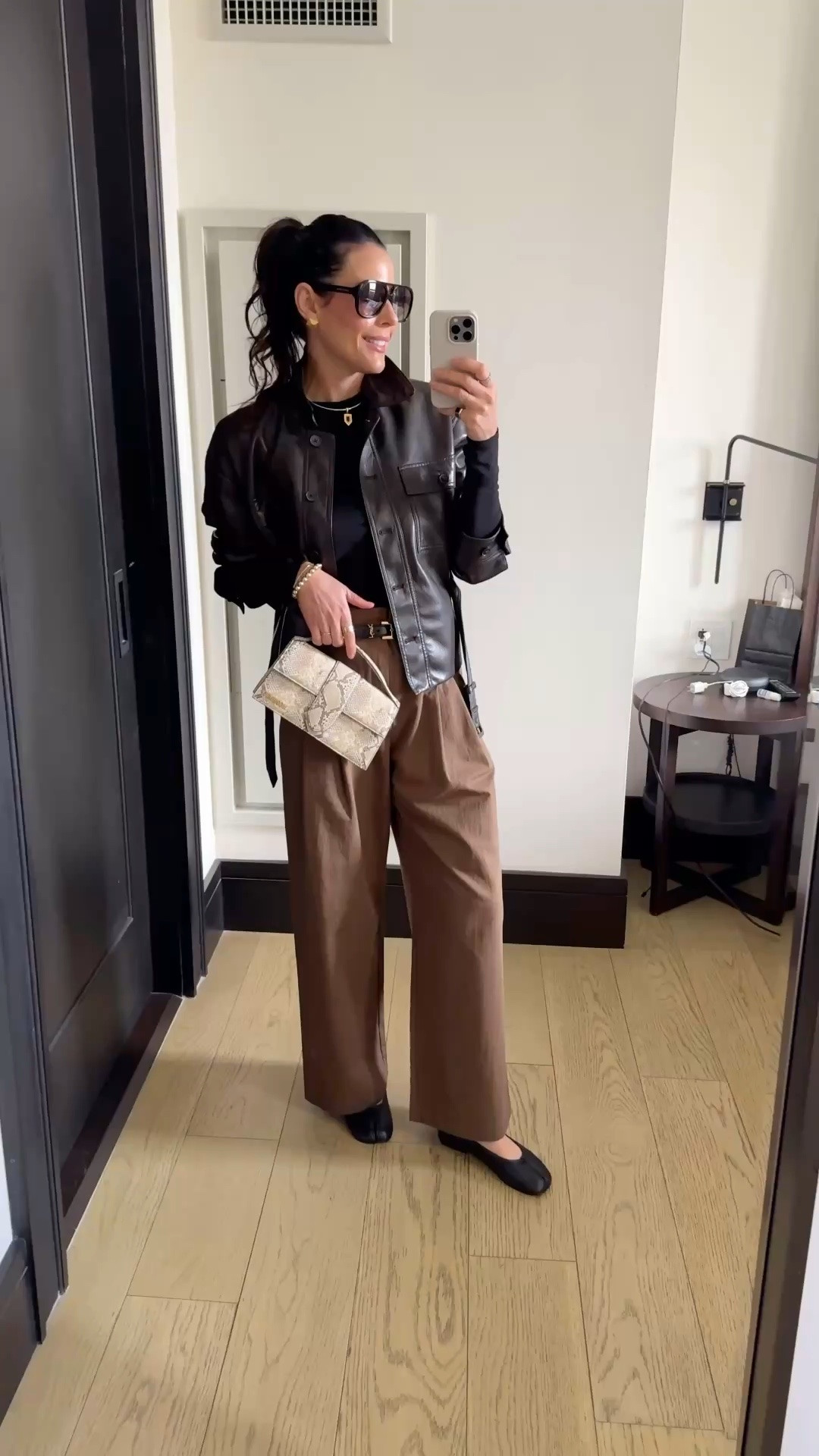 Effortlessly polished with a modern edge 🤎 this is one of those outfits that just works every time.

Wearing high-rise cotton trousers (currently on flash sale—30% off) that come with a belt, but I swapped it for a sleek thin designer belt to elevate the look. Paired it with my go-to long sleeve basic—super soft, great quality, thumb holes (we love), and perfect for layering on chillier days. Topped it off with this cropped faux leather trench in the most beautiful mocha brown.

Finished the look with those modern black flats (the Margiela-inspired Tabi ) and my borrowed designer bag from Vivrelle—honestly the best way to switch up your bags every month. Use my code DIANACAROLINA for your first month free.

#LTKootd #LTKgrwm #LTKTravel