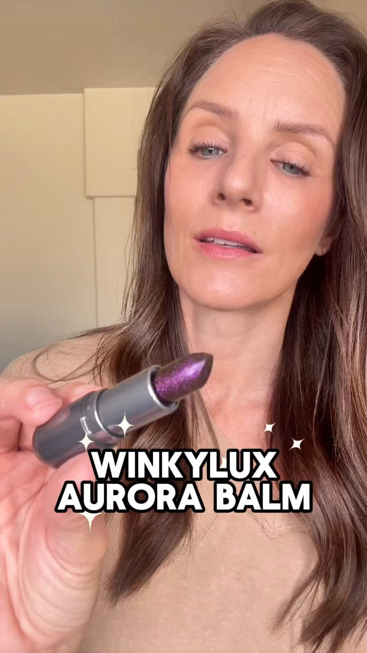 The Winky Lux Aurora Balm might be one of the prettiest lip balms I've tried lately. The rainbow quartz-inspired balm transforms into a wearable mauve tint with subtle shimmer while ceramides help keep lips feeling soft and hydrated. #winkylux #lipbalm #lipbalmset #summerlipbalms #tintedlipbalm

#LTKgrwm #LTKOver40 #LTKBeauty
