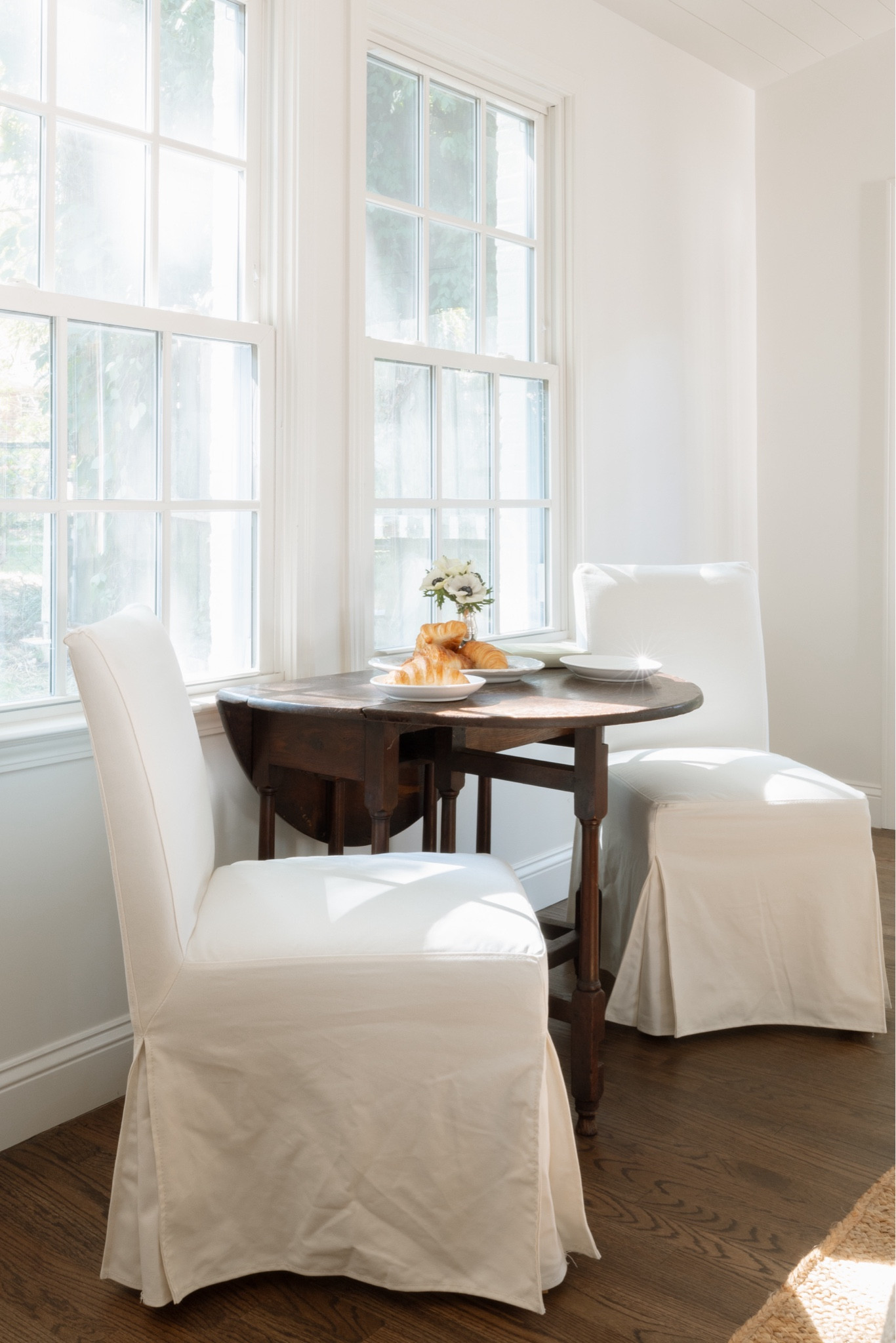A lovely breakfast table moment full of vintage pieces and character 

Armless slipcovered dining chairs

#LTKHome